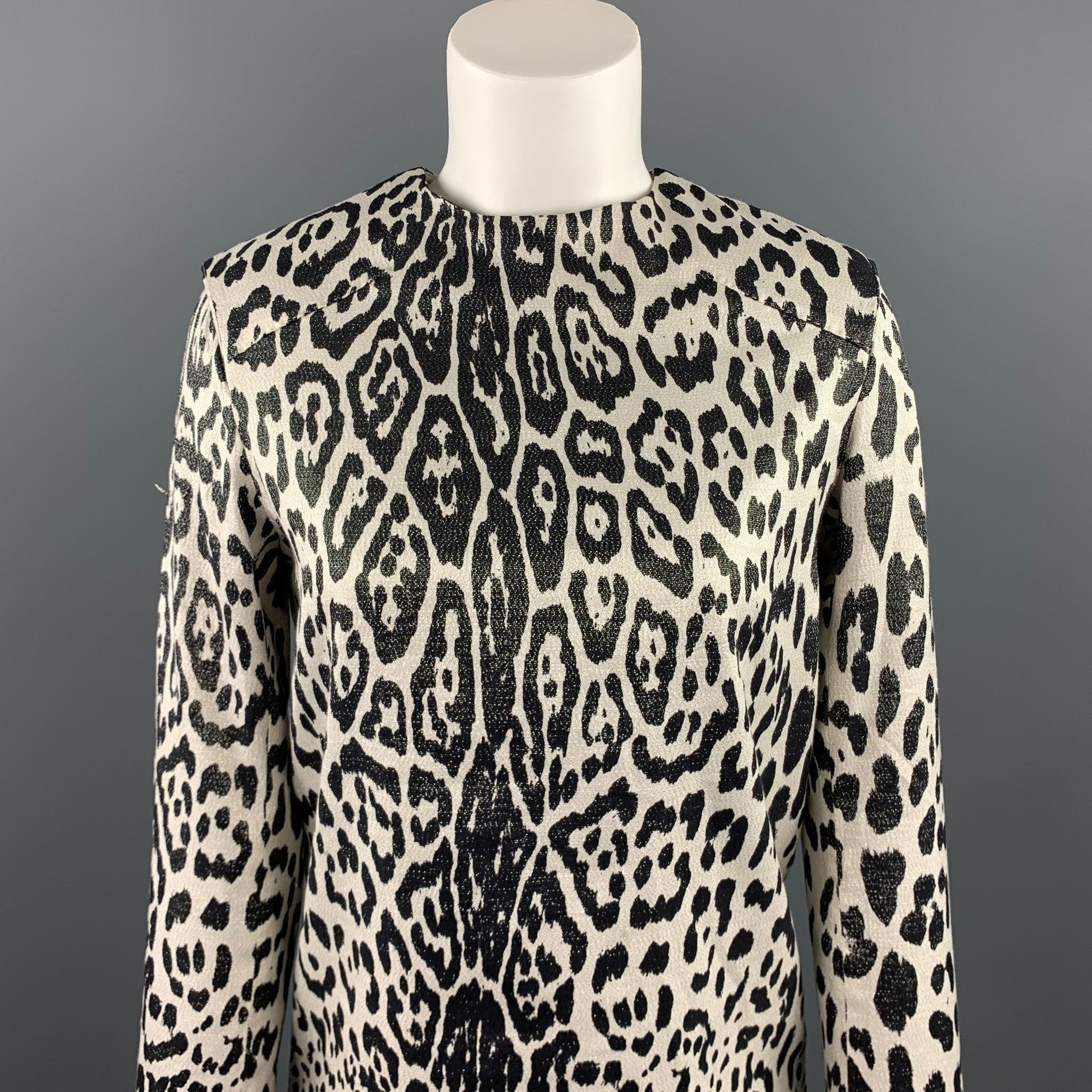 HAIDER ACKERMANN blouse comes in a silver & black leopard print silk blend featuring stitching details and back zip up closure.Excellent
Pre-Owned Condition. 

Marked:   34 

Measurements: 
 
Shoulder: 16 inches 
Bust: 36 inches 
Sleeve: 26.5 inches