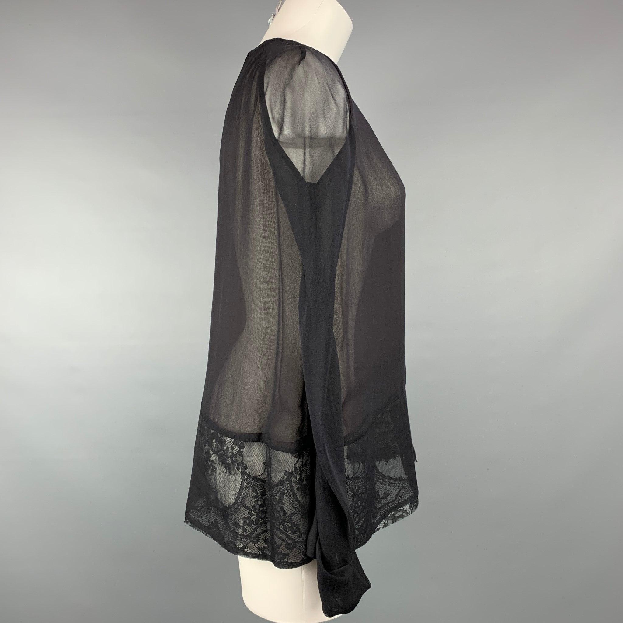 HAIDER ACKERMANN blouse comes in a black & brown silk with a lace panel folded cuffs and a hook & loop closure. Made in Portugal.
Very Good
Pre-Owned Condition. 

Marked:   40 

Measurements: 
 
Shoulder:
17 inches  Bust: 40 inches  Sleeve: 26