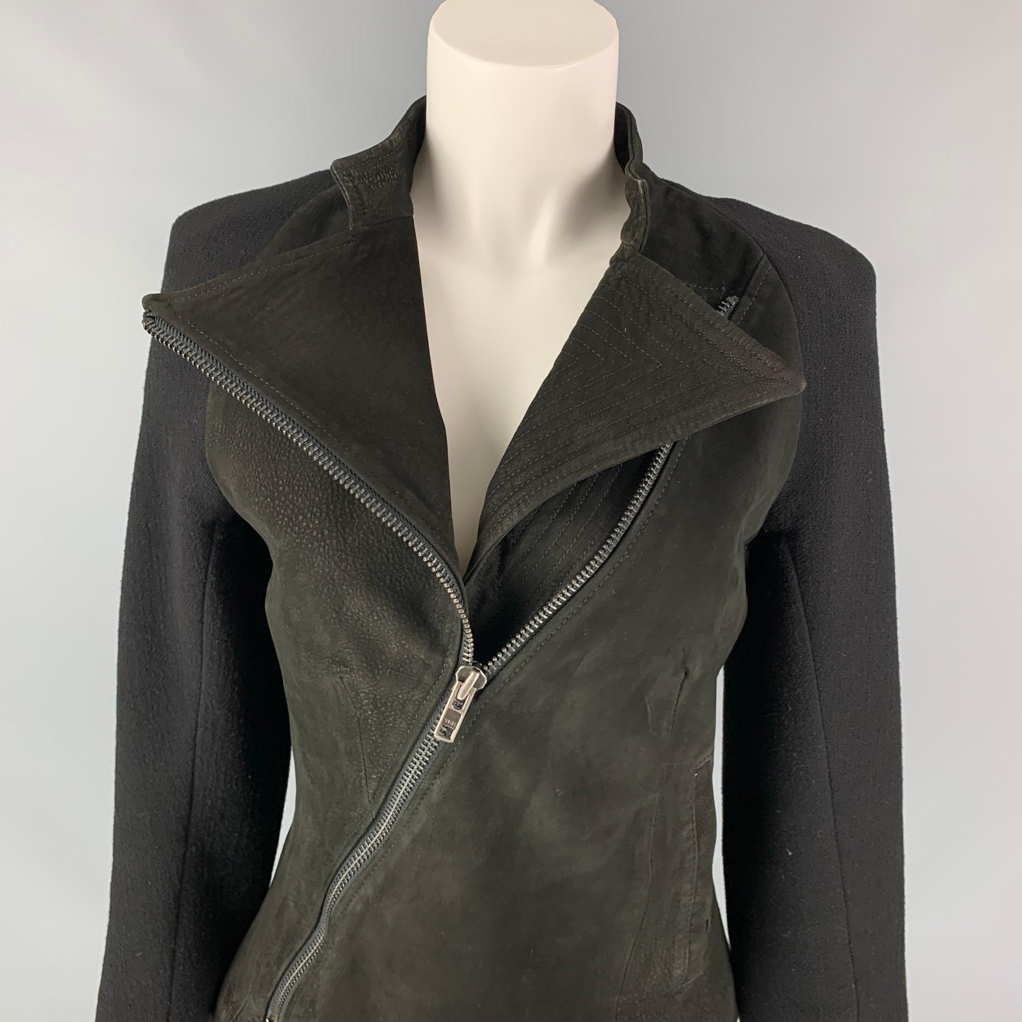 HAIDER ACKERMANN jacket comes in a black virgin wool with a suede panel design featuring a full liner, slit pockets, stand up collar, and a asymmetrical zip up closure. Made in Italy.

Very Good Pre-Owned Condition.
Marked: