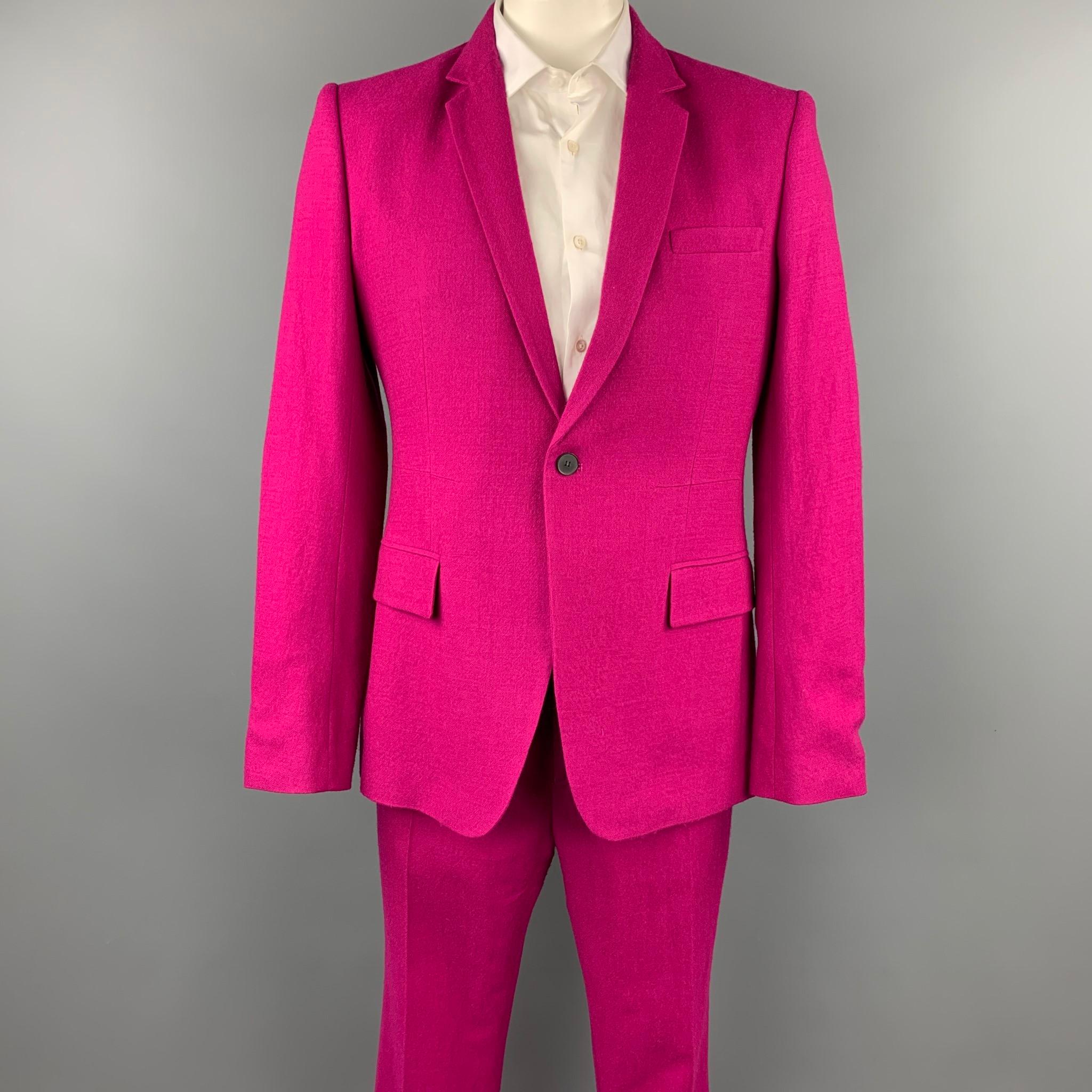 HAIDER ACKERMANN suit comes in a raspberry wool with a full liner and includes a single breasted, single button sport coat with a notch lapel and matching flat front trousers. Made in Romania.

Very Good Pre-Owned Condition.
Marked: EU