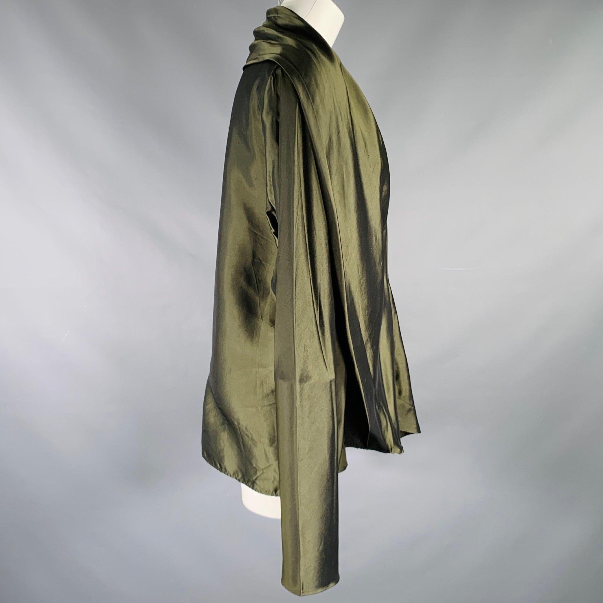HAIDER ACKERMANN jacket
in an olive green rayon fabric featuring an oversized shawl lapel, long sleeves, and button closure. Made in Portugal.Good Pre-Owned Condition. Moderate signs of wear and marks. As is. 

Marked:   42 

Measurements: 
