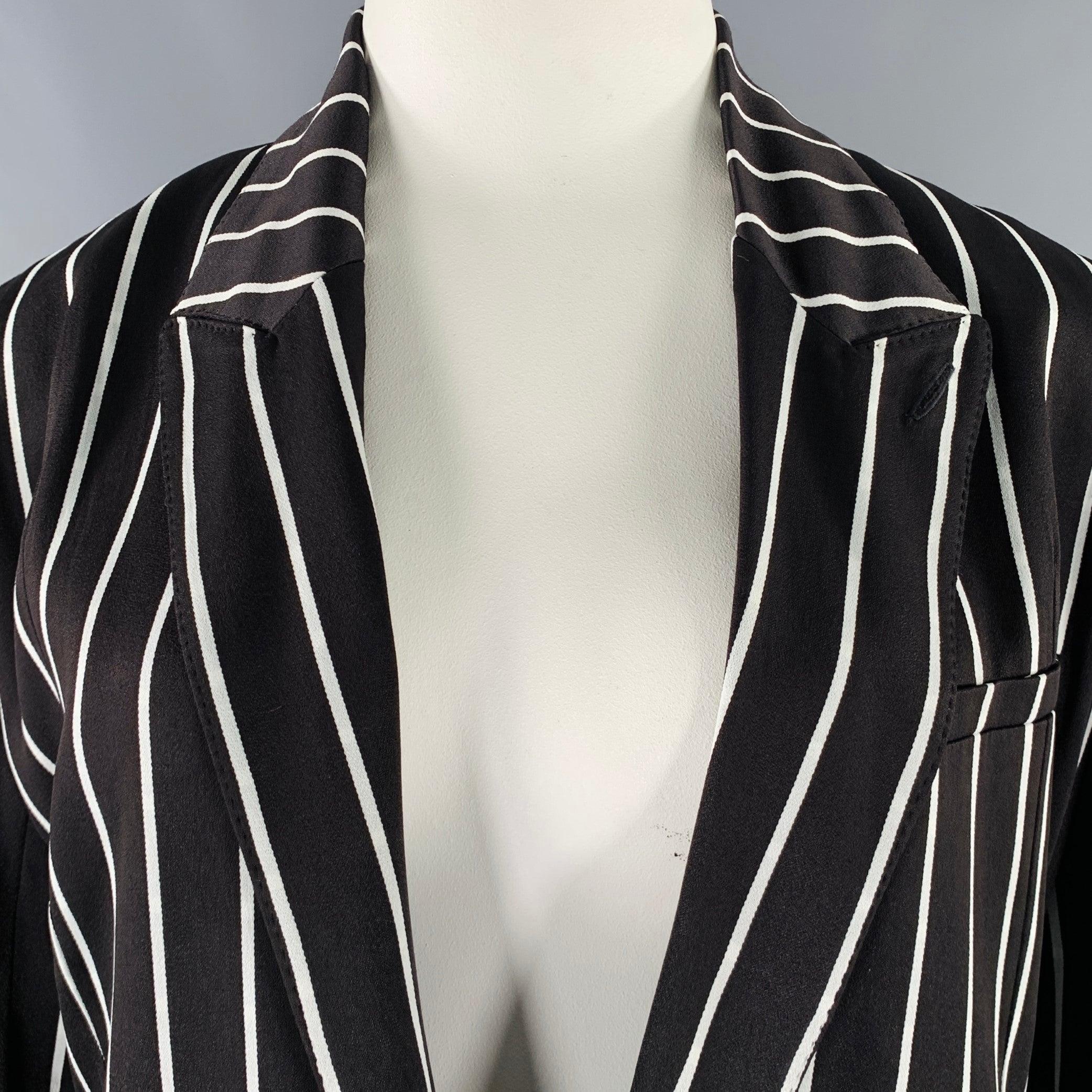 HAIDER ACKERMANN blazer
in a black and white rayon fabric featuring a stripe pattern, peak lapel, and double button closure. Made in Romania.Excellent Pre-Owned Condition. 

Marked:   42 

Measurements: 
 
Shoulder: 18.5 inches Bust: 46 inches