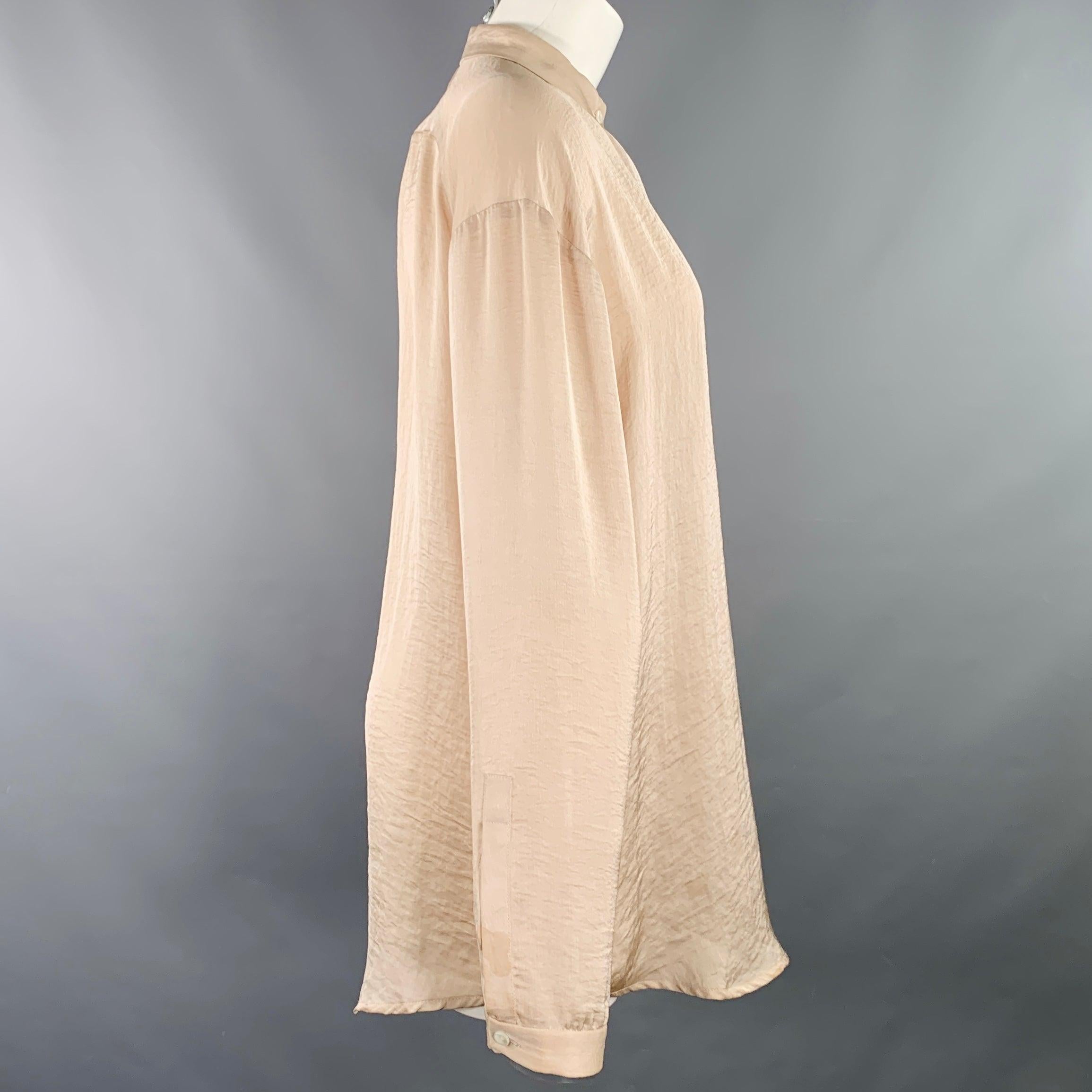 HAIDER ACKERMANN shirt
in a rose pink woven fabric featuring a collarless style, and hidden button closure.Very Good Pre-Owned Condition. Minor marks. 

Marked:   IT 40 

Measurements: 
 
Shoulder: 20.5 inches Bust: 44 inches Sleeve: 22 inches