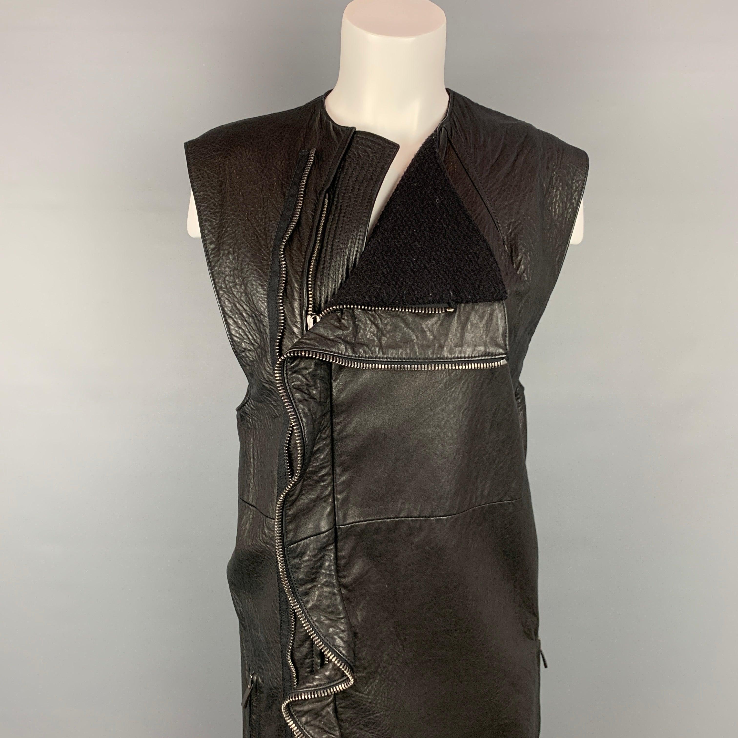 HAIDER ACKERMANN vest comes in a black leather with a full liner featuring slit pockets and a ruffled double full zip closure. Made in Italy.Very Good
Pre-Owned Condition. 

Marked:   38 

Measurements: 
 
Shoulder: 16.5 inches  Bust: 38 inches 