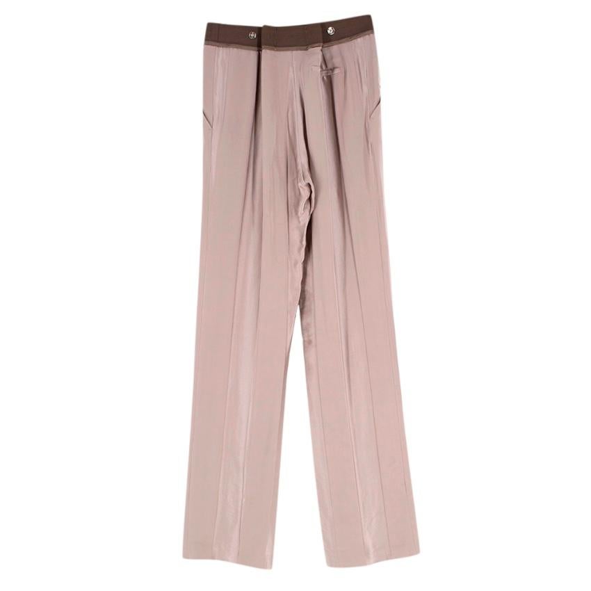 Haider Ackermann Taupe Silk Striped Texture Trousers

-Luxurious silk surface with a matte vs shiny striped texture
-Lightweight comfortable fabric 
-Green bias tape detail to the waist 
-Adjustable pleat details to the back  
-Elasticated waist for