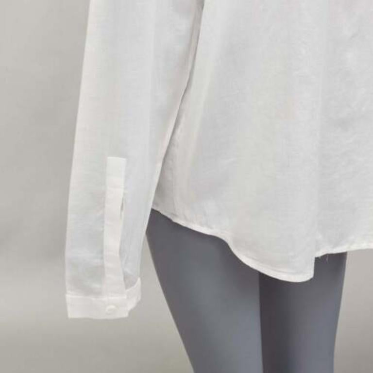 HAIDER ACKERMANN white 100% cotton bishop collar oversized flowy shirt FR34 XS
Reference: CNLE/A00292
Brand: Haider Ackermann
Material: Cotton
Color: White
Pattern: Solid
Closure: Button
Extra Details: Curved dropper shoulder yoke at back.
Made in:
