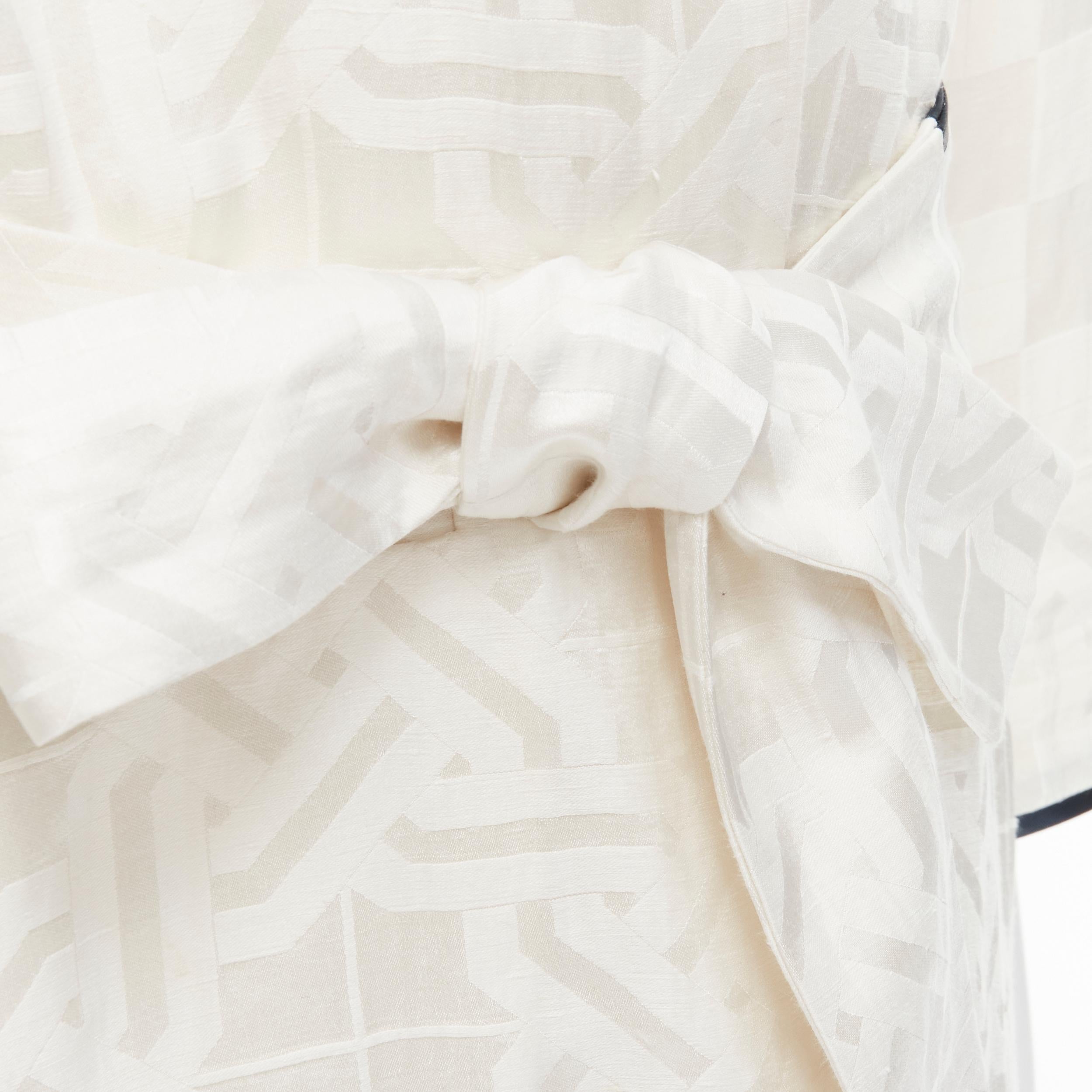 HAIDER ACKERMANN white geometric jacquard linen silk belted robe shirt FR36 XS 
Reference: TGAS/B01956 
Brand: Haider Ackermann 
Designer: Haider Ackermann 
Material: Linen 
Color: White 
Pattern: Geometric 
Closure: Belt 
Extra Detail: Womenswear