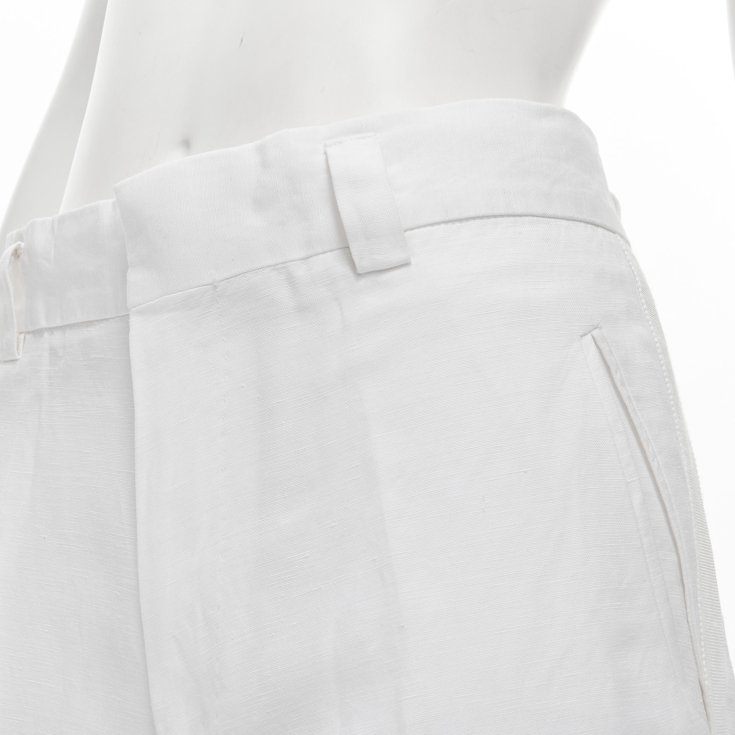 HAIDER ACKERMANN white grosgrain linen drop crotch cropped trousers FR38 S 
Reference: CNLE/A00129 
Brand: Haider Ackermann 
Designer: Haider Ackermann 
Material: Linen 
Color: White 
Pattern: Solid 
Closure: Zip 
Made in: Romania 

CONDITION: