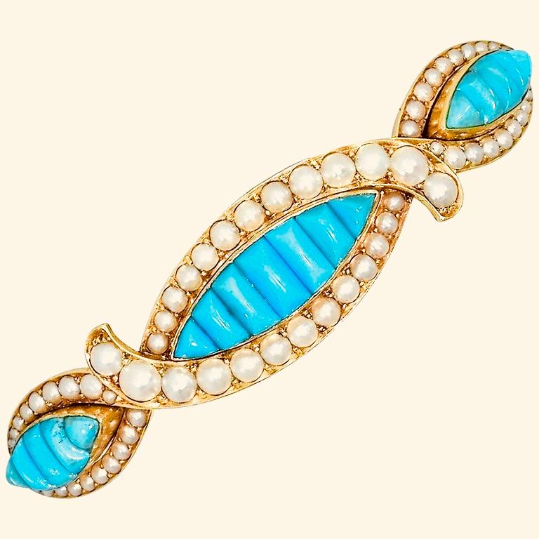 Barrette for the hair in natural Persian turquoise and natural oriental pearls are set in gold to create this antique hair barrette.  2.75 inches long.  15K gold and probably European.  Circa 1880.  Back restore for durability consistent with age