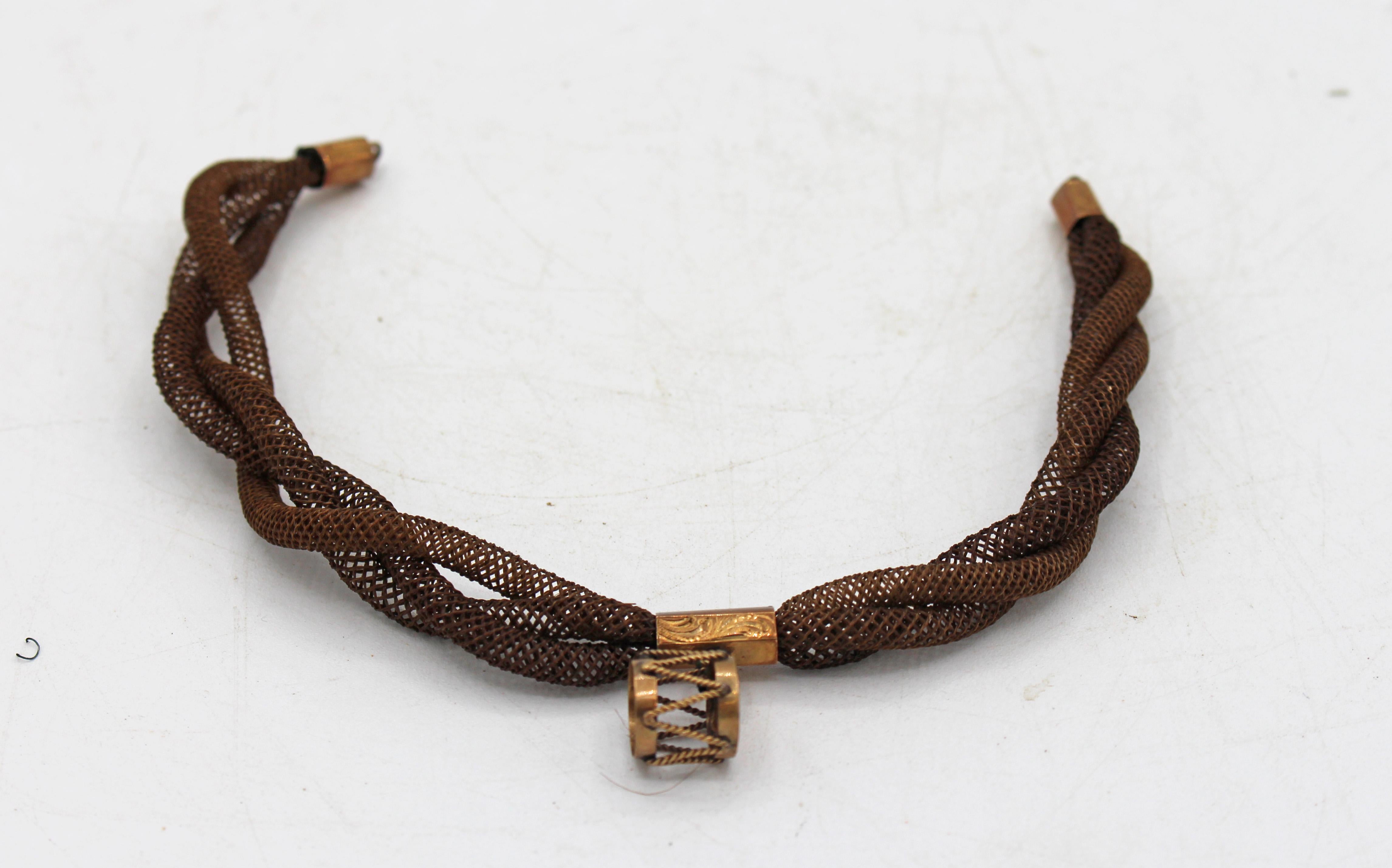 Hair bracelet descended from the mother of patriot Nathan Hale. Hale was handed in 1776. Gilt fittings & drum engraved 