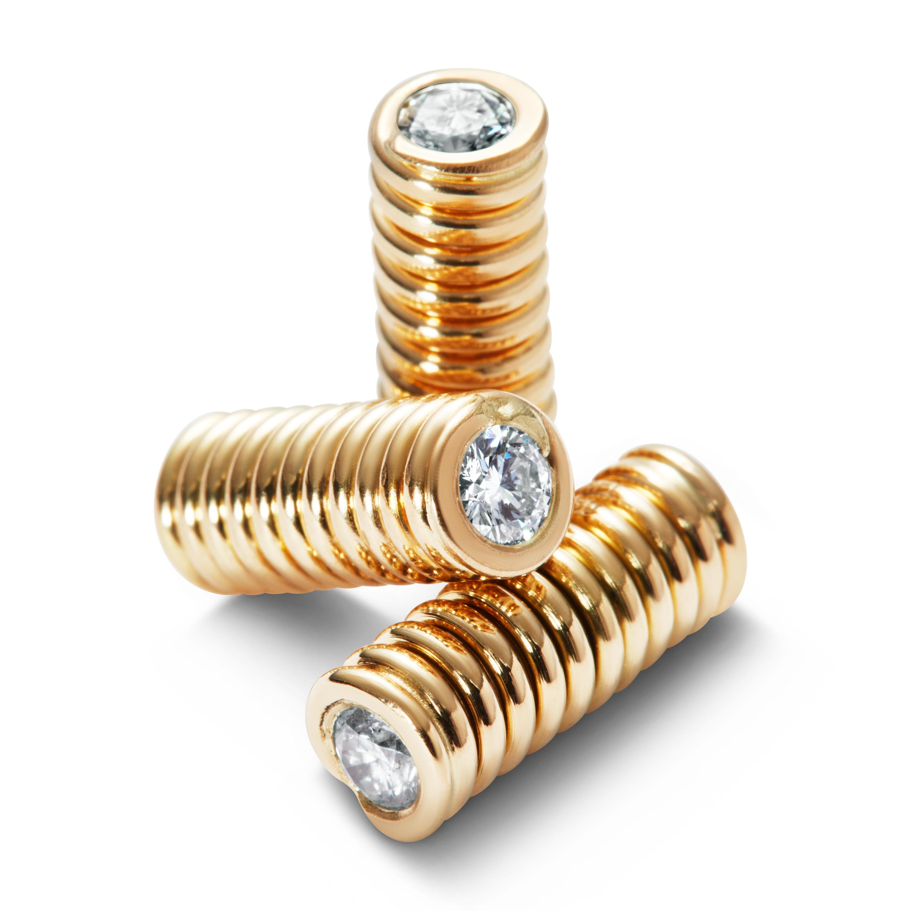 A unique piece of hair jewelry made in 18 karat gold with two brilliant cut traceable diamonds 0.16ct clarity VS and color G. The Diamond Spring is a unique way to place two drops of diamonds sparkling in your hair. 

The journey from raw diamond to