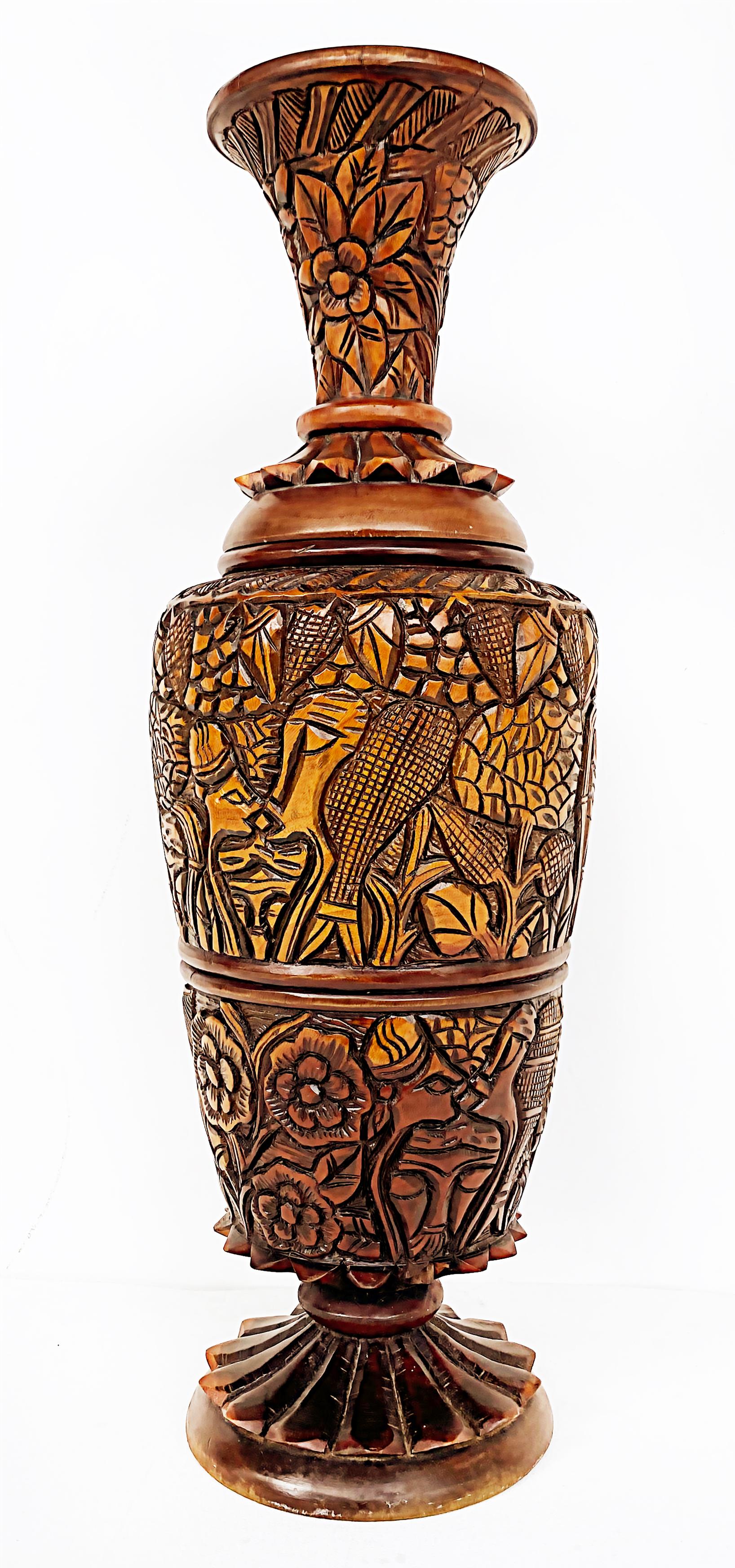 Haitian Heavily Hand Carved Wood 2-Piece Vase 

Offered for sale is a primitive Haitian heavily hand-carved wood 1-piece vase.