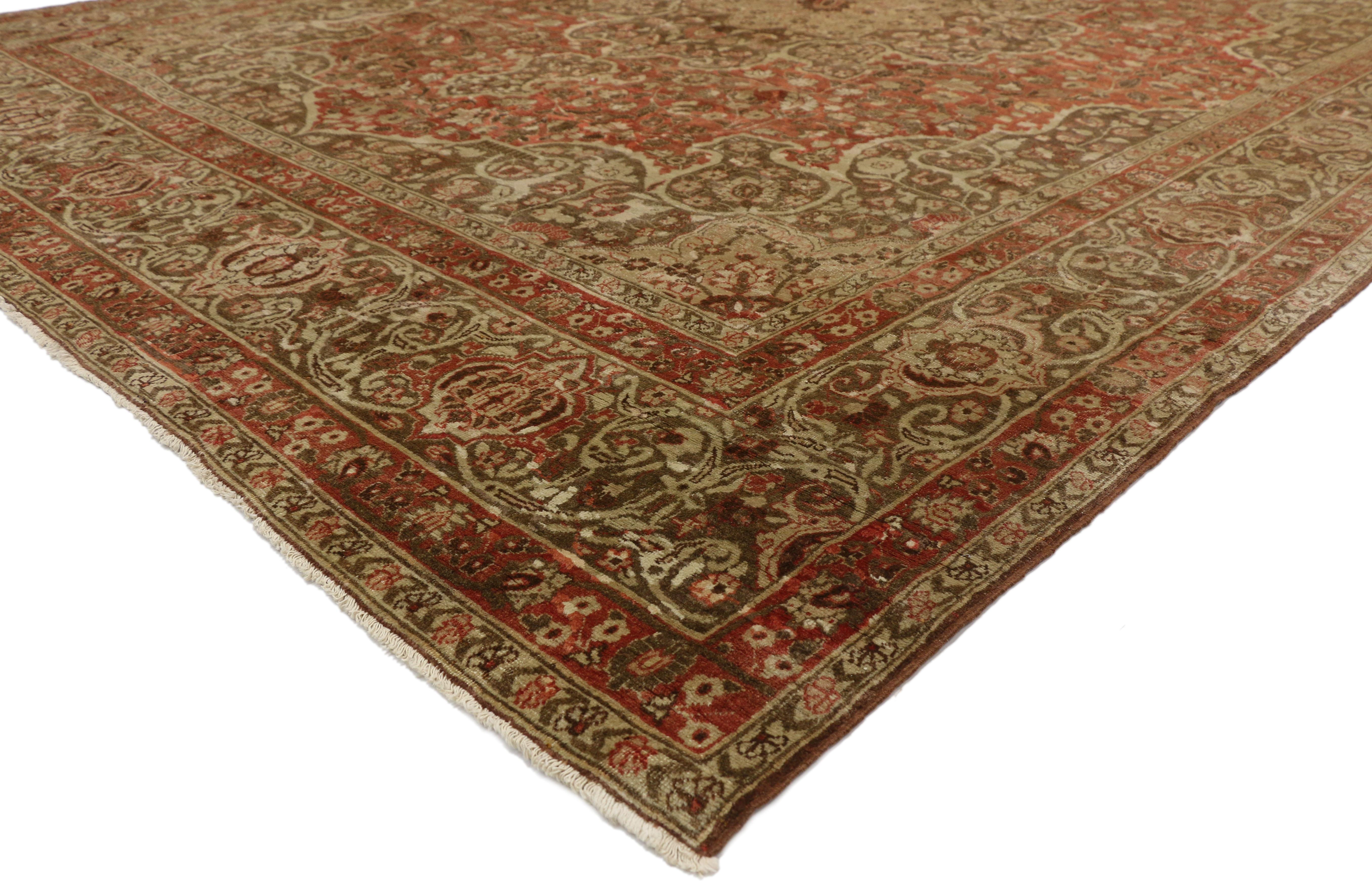 50392 Haji Khalili Antique Persian Tabriz Area rug with Rustic Art Nouveau style. This Haji Khalili antique Persian Tabriz area rug features an eight-point beige medallion floating inside a brown cusped trefoil center medallion anchored with finials
