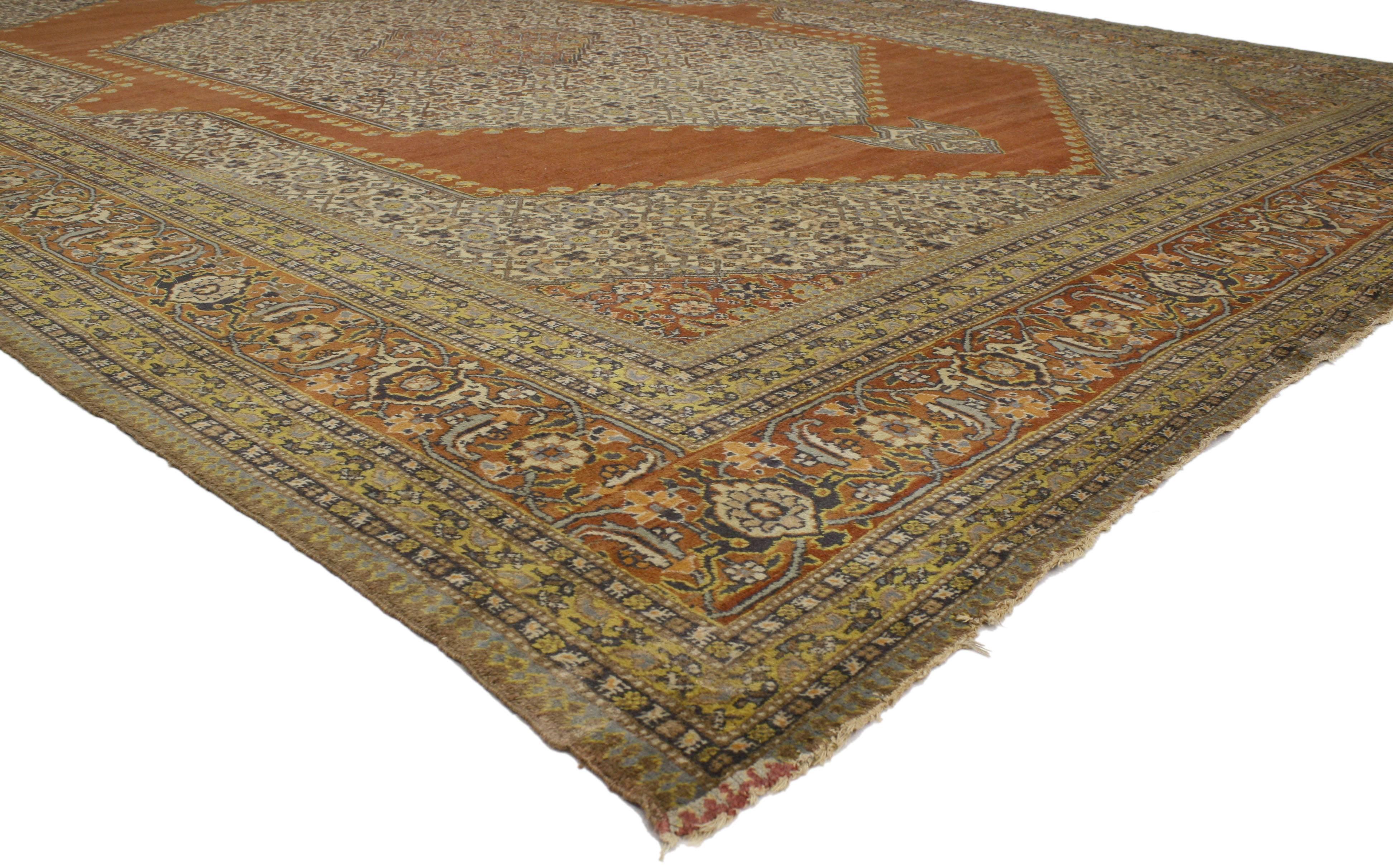 77050 Haji Khalili Antique Persian Tabriz Rug with Modern Rustic Spanish Style 11'04 x 15'09. Warm and inviting, this hand-knotted wool Haji Khalili antique Persian Tabriz rug beautifully embodies a modern rustic Spanish style. The field features a