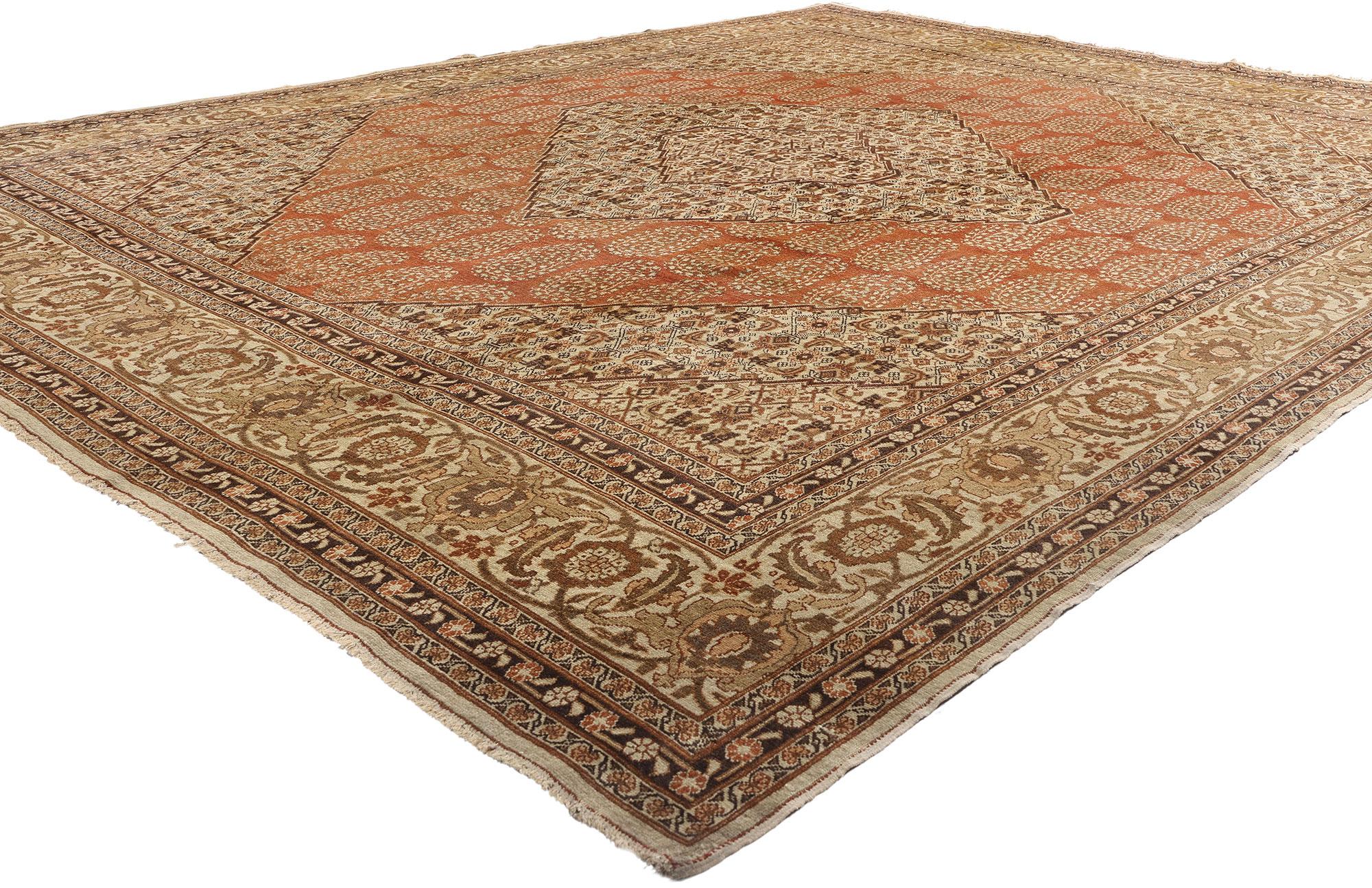 73538 Haji Khalili Antique Persian Tabriz Rug, 10'00 x 12'02. This hand knotted wool antique Persian Tabriz rug, crafted by the esteemed Haji Khalili workshop, stands as a testament to the masterful artistry that defines the rich carpet-making