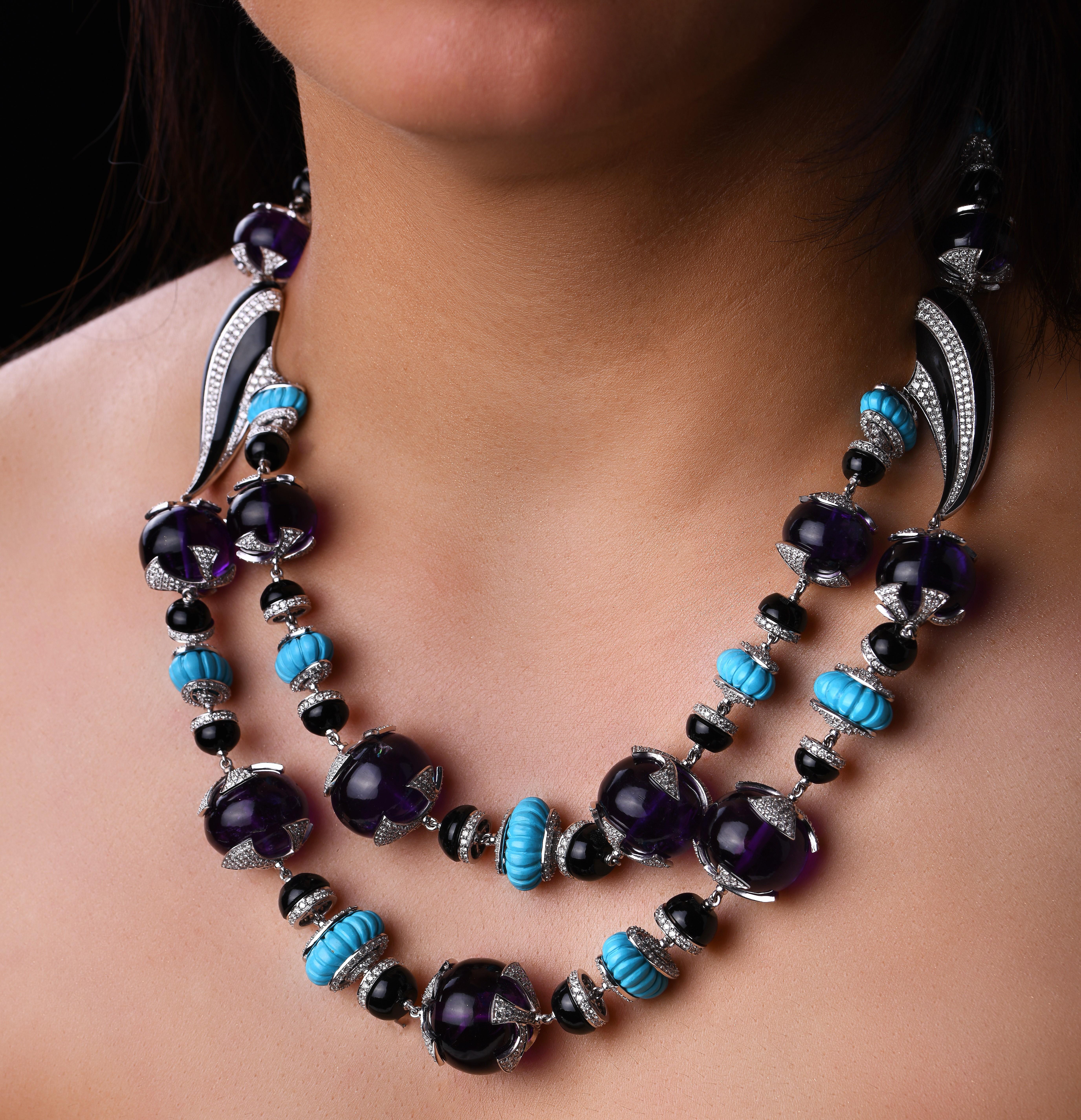 A stunning exotic 2 line necklace in amethyst, carved turquoise & black enamel with diamonds. Comprising 13 gorgeous Amethyst large beads capped with diamond pave petals, alternating with carved turquoise pumpkin beads. Both the gemstones are