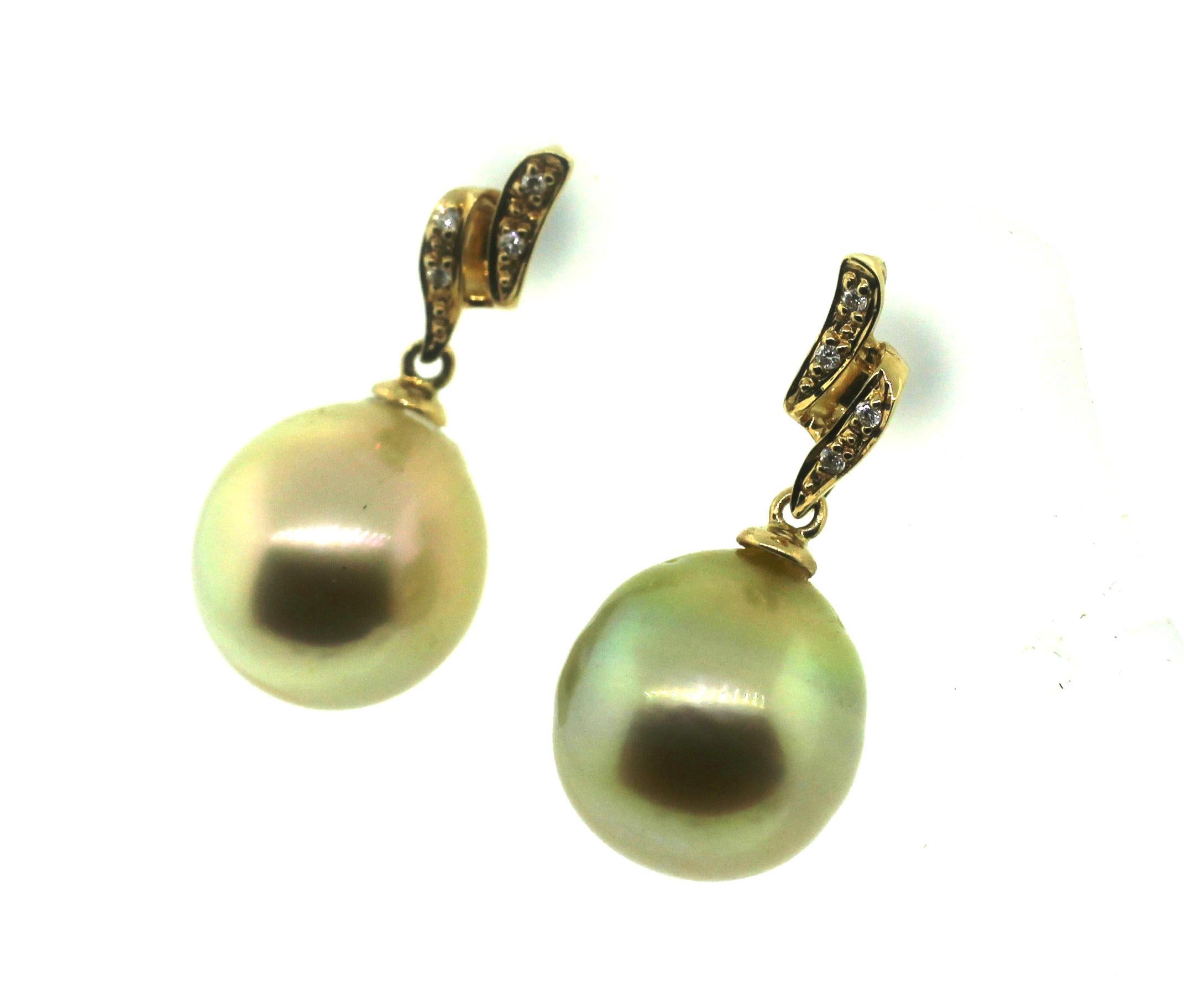Hakimoto By Jewel Of Ocean
18K Yellow Gold and Diamond 
Fancy Natural Color Golden South Sea Coultured Pearl Earrings.
Total item weight 6.3 grams
Round Brilliant Diamonds
12 mm Fancy Natural color Golden South Sea Cultured Pearls
18K Yellow Gold