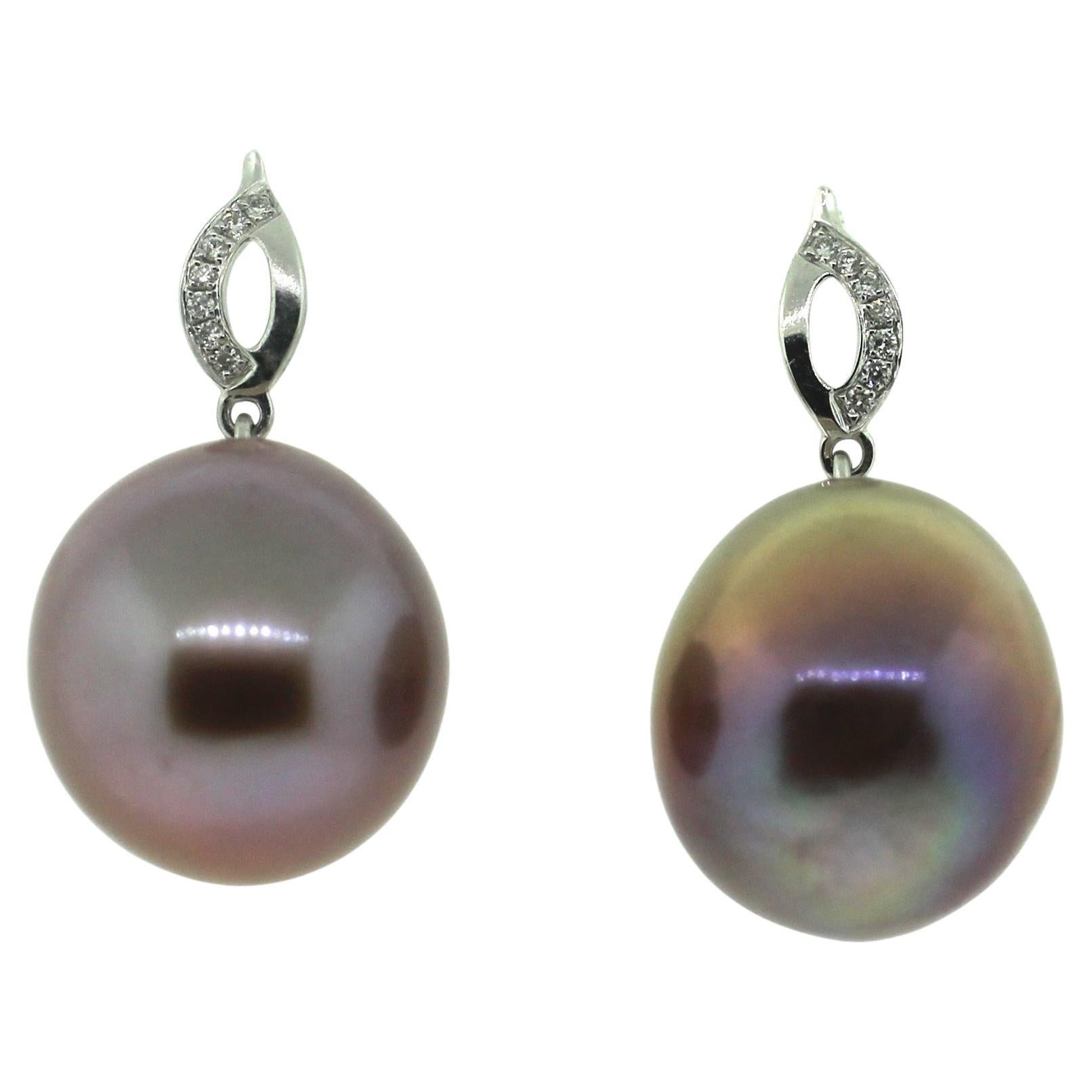 Hakimoto By Jewel Of Ocean
18K White Gold and Diamond 
Natural Color Drop Pearl Earrings
Total item weight 7 grams
Featuring 0.03 Carats of Round Brilliant Diamonds
12=14mm South Sea Drop Cultured Pearls
18K Yellow Gold High Polish
Orient: Very