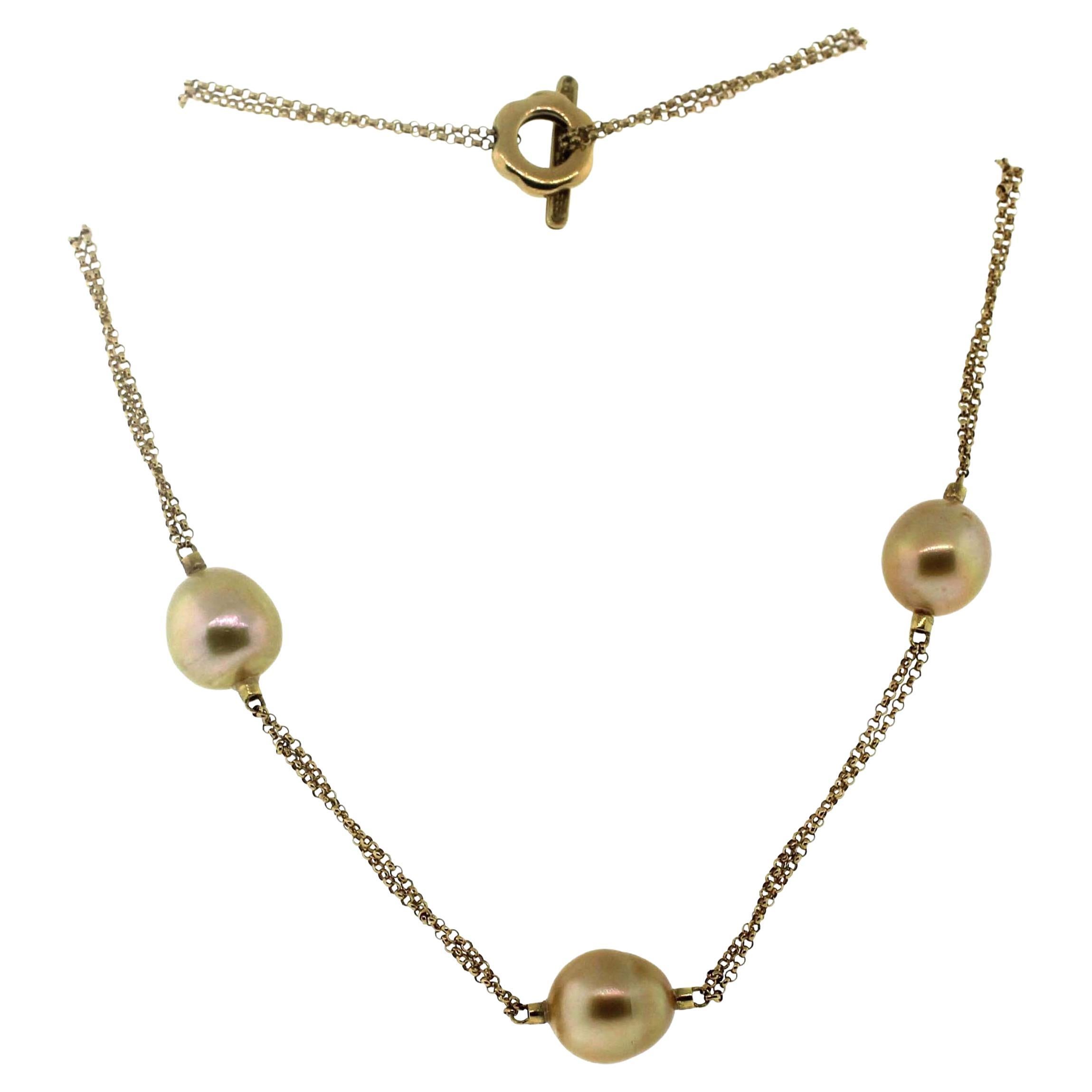 Hakimoto By Jewel Of Ocean Station Necklace
A classic and wearable Natural Color South Sea Station Baroque pearl necklace. 
The necklace is Made with 7 Baroque South Sea Pearls size 12mm. 
The pearls are connected by 18 karat Yellow gold 18k Italian