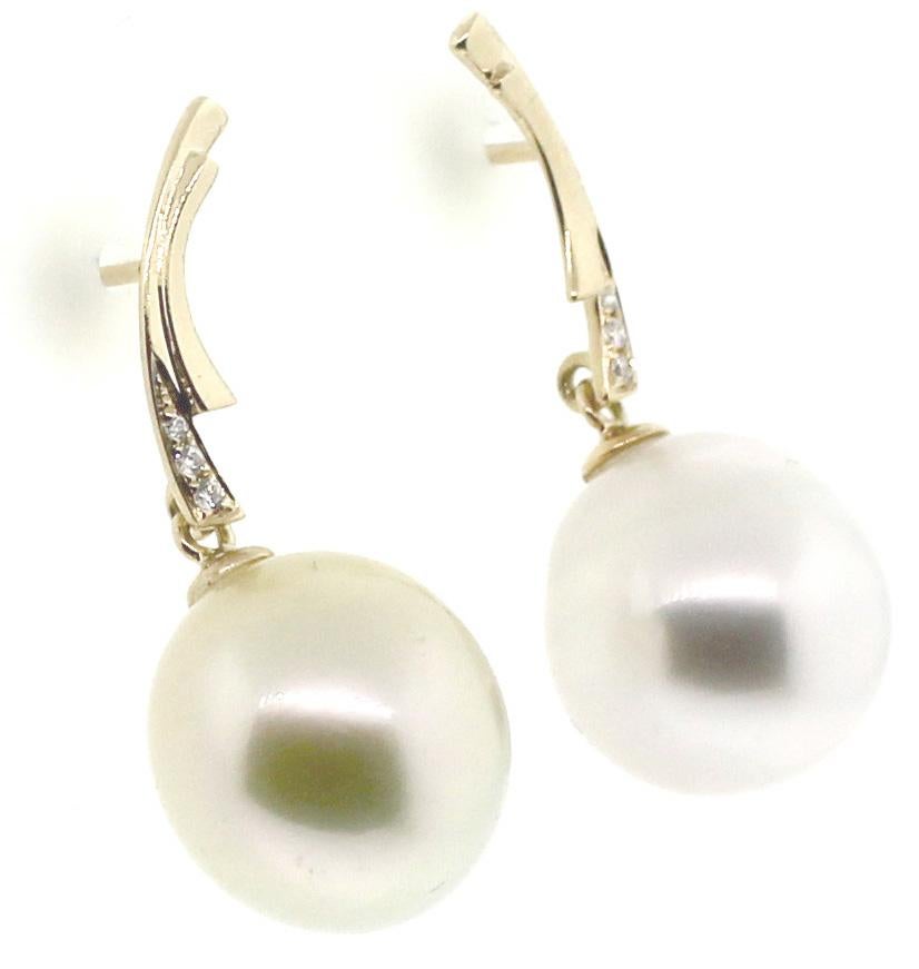 Hakimoto By Jewel Of Ocean
Manufacture Suggested Retail Price $3,000
12mm  South Sea Drop Pearl 
18K Yellow Gold Earrings
6 Round Diamonds 0.037 Carts
1.1