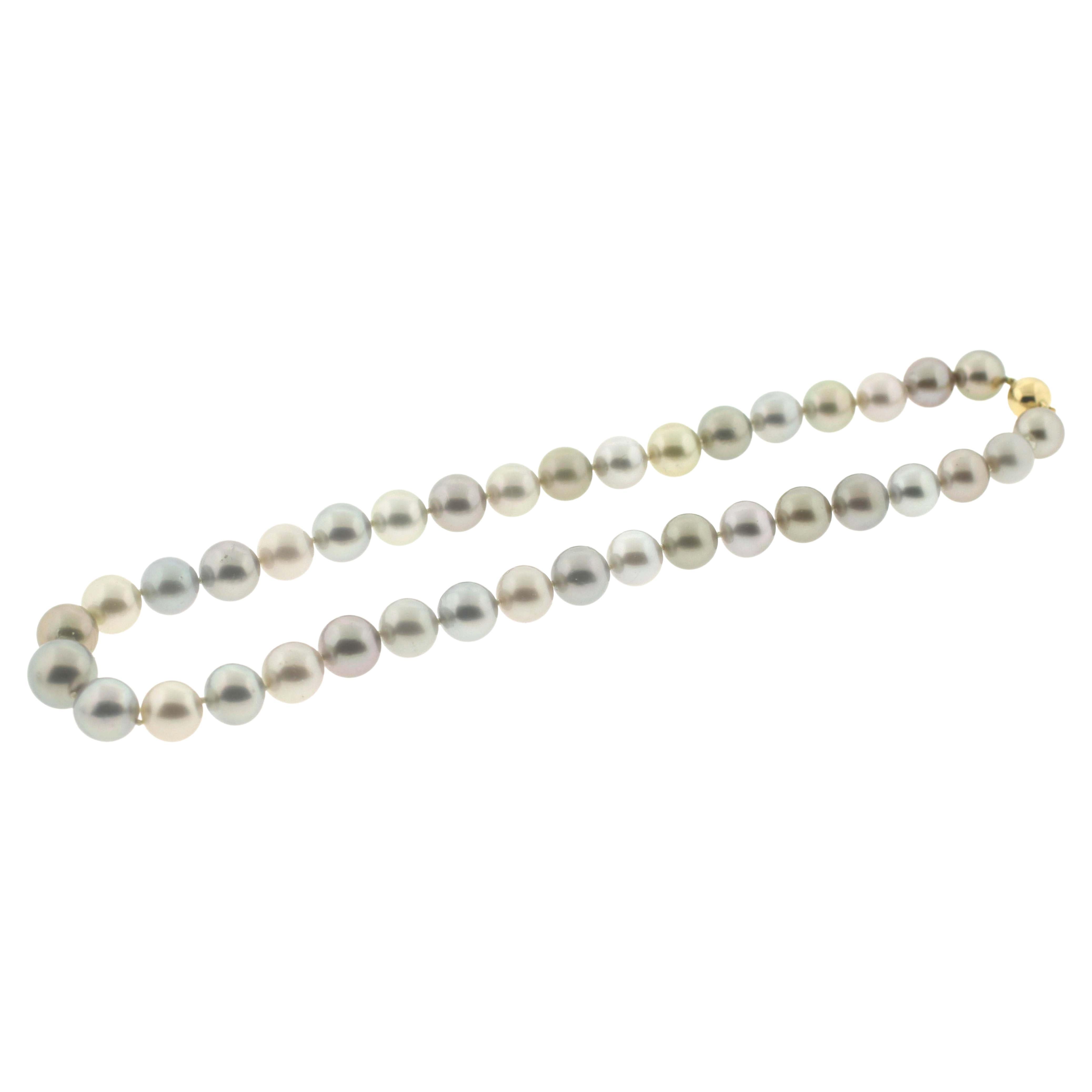Hakimoto By Jewel Of Ocean 18K Tahitian Pastel Fancy Color Strand Necklace
18K Yellow Gold And Diamonds Clasp 
Weight (g): 69.7
Cultured Tahitian South Sea Pearl 
Pearl Size: 12X9mm 
Pearl Shape: Round 
Body color: Pastel
Orient: Good
Luster: Good