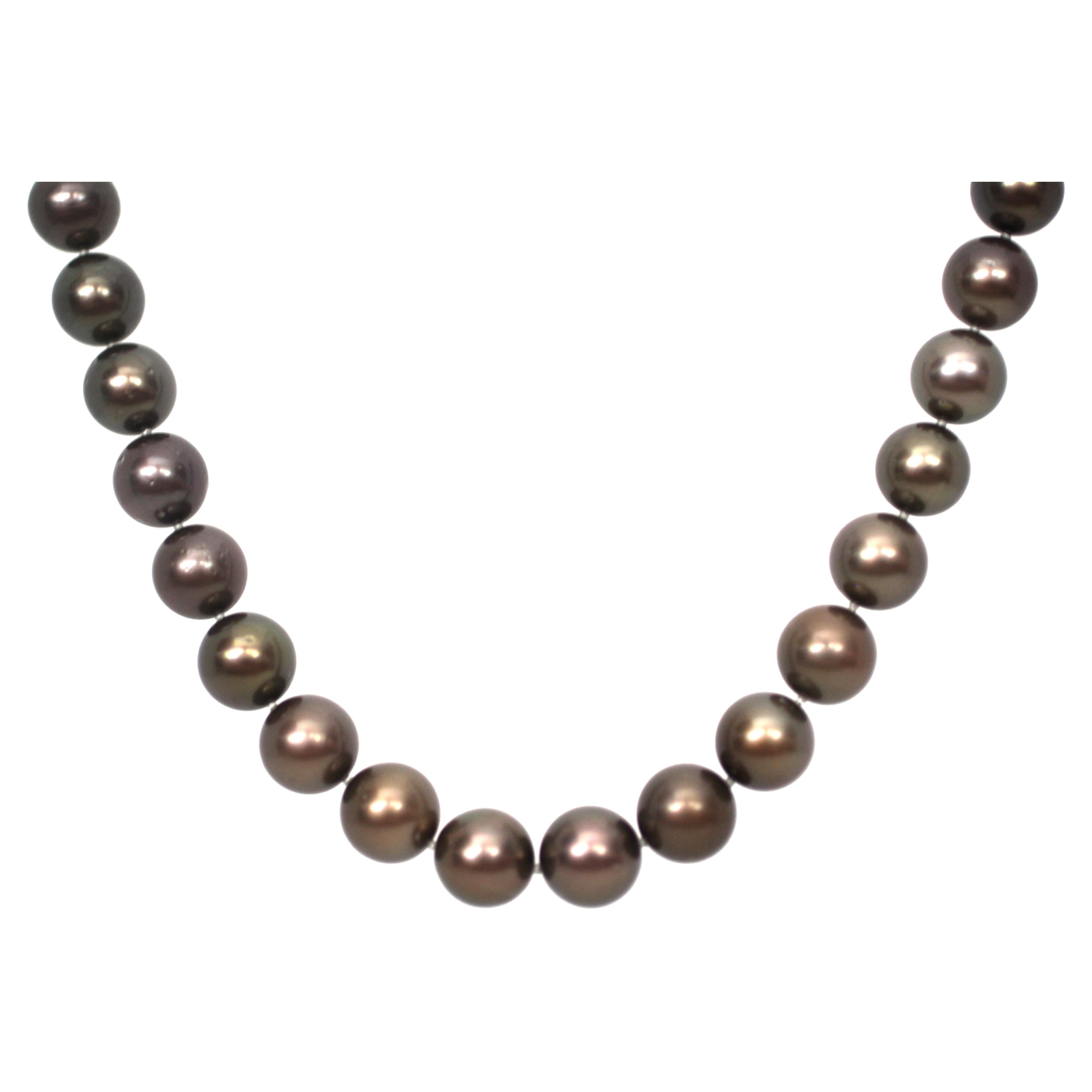 Hakimoto By Jewel Of Ocean 18KTahitian South Sea Strand Necklace
18K White Gold With Diamond Clasp 
Weight (g): 76.8
Cultured Tahitian South Sea Pearl 
Pearl Size: 11X12mm 
Pearl Shape: Round 
Body color: Brown
Orient: Good
Luster: Good 
Surface: