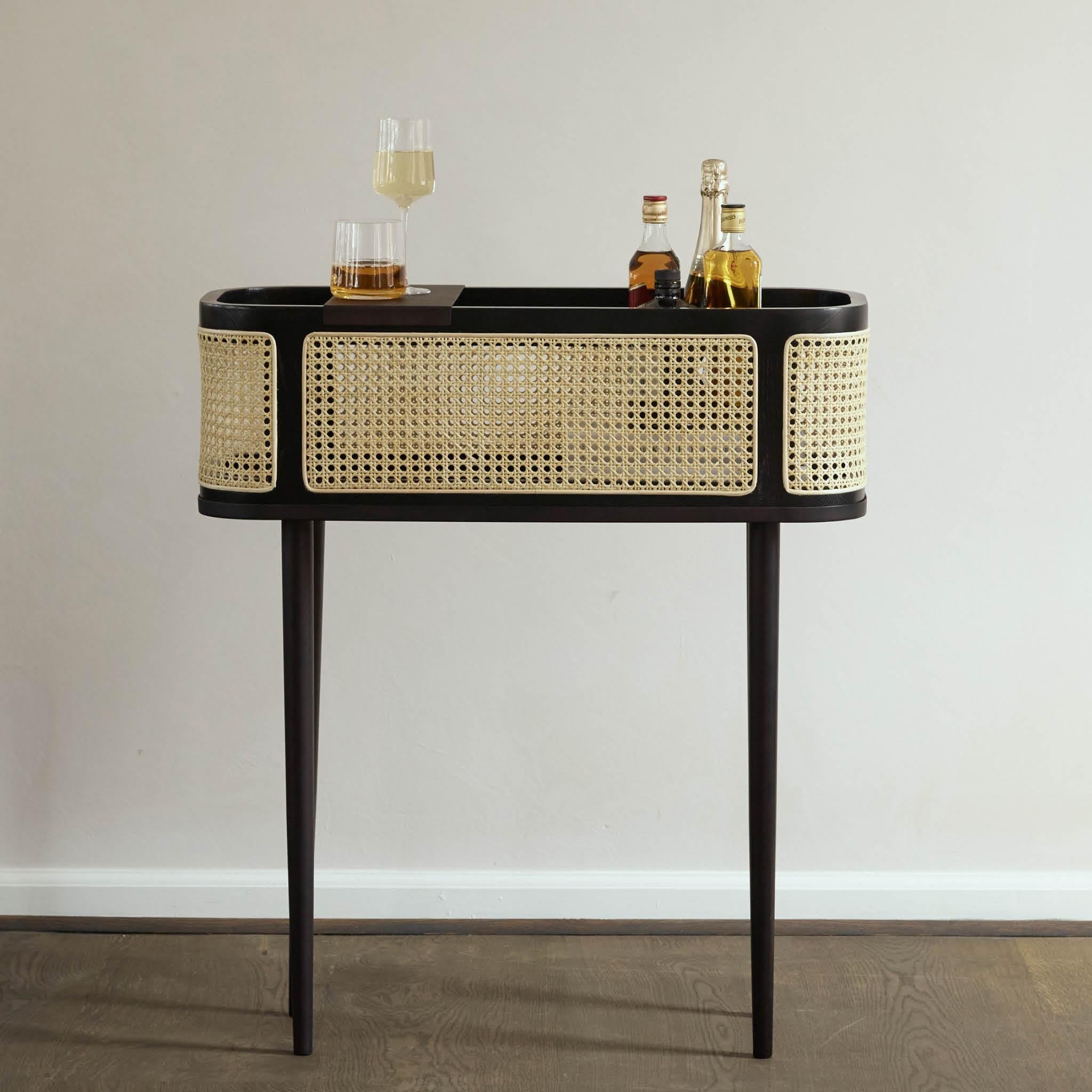 Hako ash bar mesh by 101 Copenhagen
Designed by Kristian Sofus Hansen & Tommy Hyldahl
Dimensions: L90 / W80 /H32 CM
Materials: metal, ash, french bamboo mesh

Hako, the Japanese word for box or storage, is a collection of storage and furniture