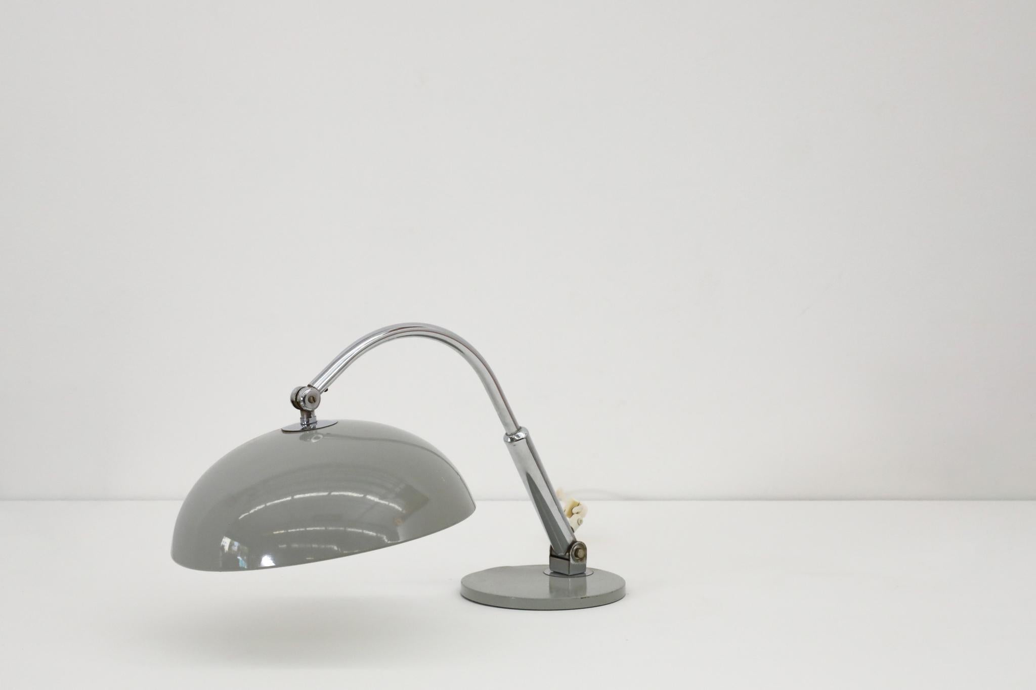 Mid-Century Hala '144' Gray enameled desk lamp with adjustable dome shade and chrome stem attached to a weighted gray metal base. Symmetrically styled with soft curves and functional directional light. In its original condition with some visible