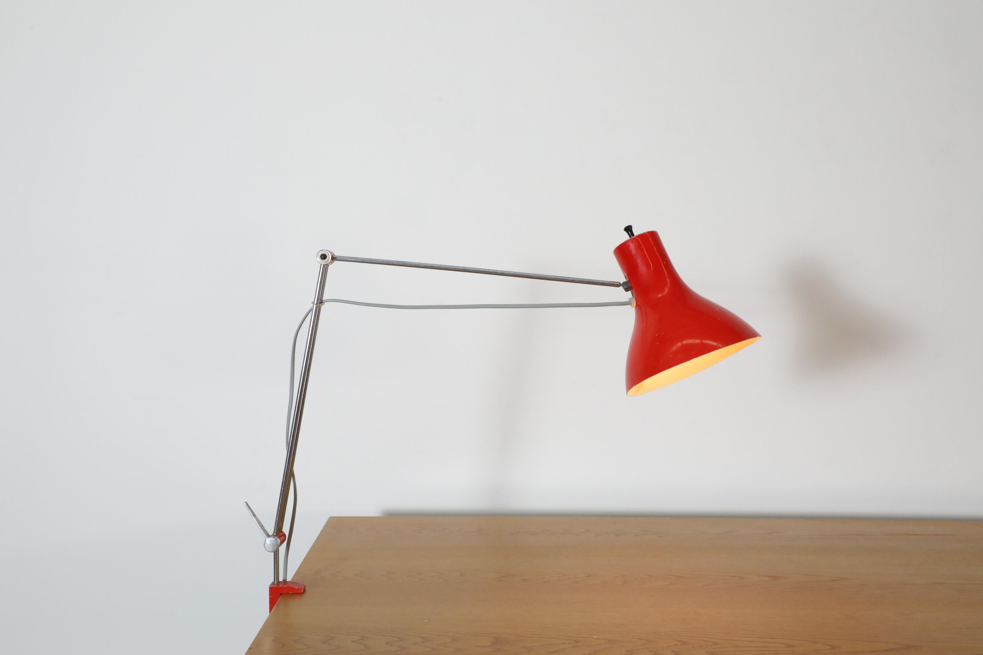 Cool Hala style Industrial clamp on desk lamp with red enameled aluminum shade and adjustable chrome stem with matching red metal clamp that fits on a table up 1.75
