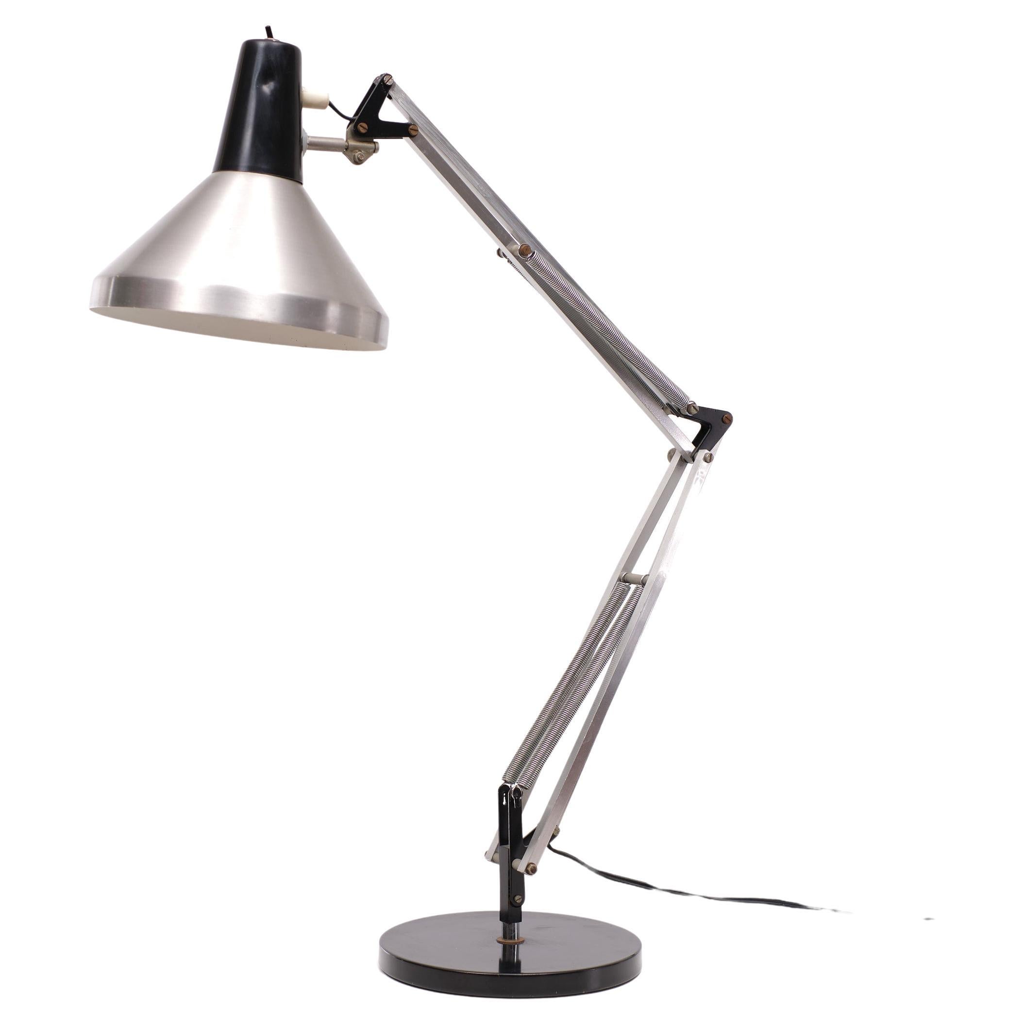 Dutch Design this Hala Zeist Architect en table or desk lamp. Model T9 
1960s Very nice example. Works perfect. Light in every direction you want.
One large E27 bulb needed.