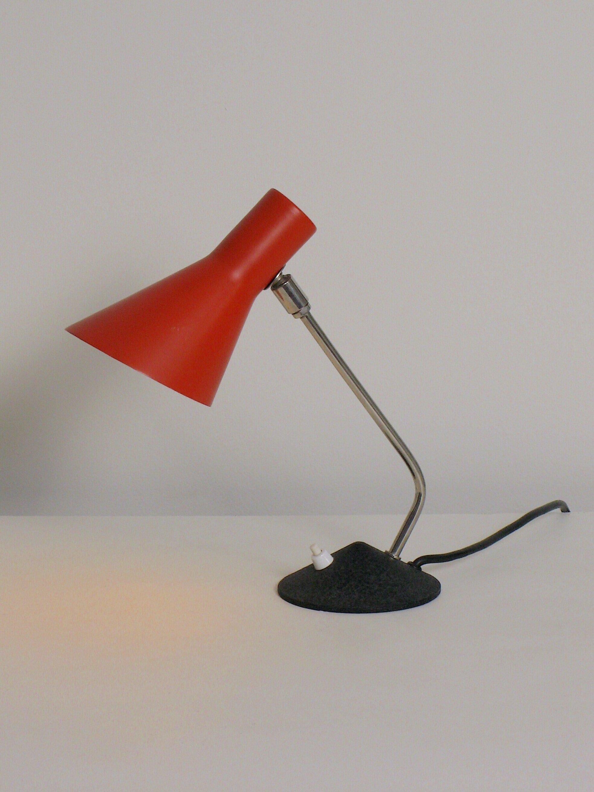 Desk Lamp manufactured in Zeist, Netherlands by Hala in the 1950’s.  Enameled steel shade, polished steel stem, enameled steel base.  60 watts max E-14 (European bulb) incandescent bulbs recommended or higher if LED/CFL.

Original E-14 base socket, 