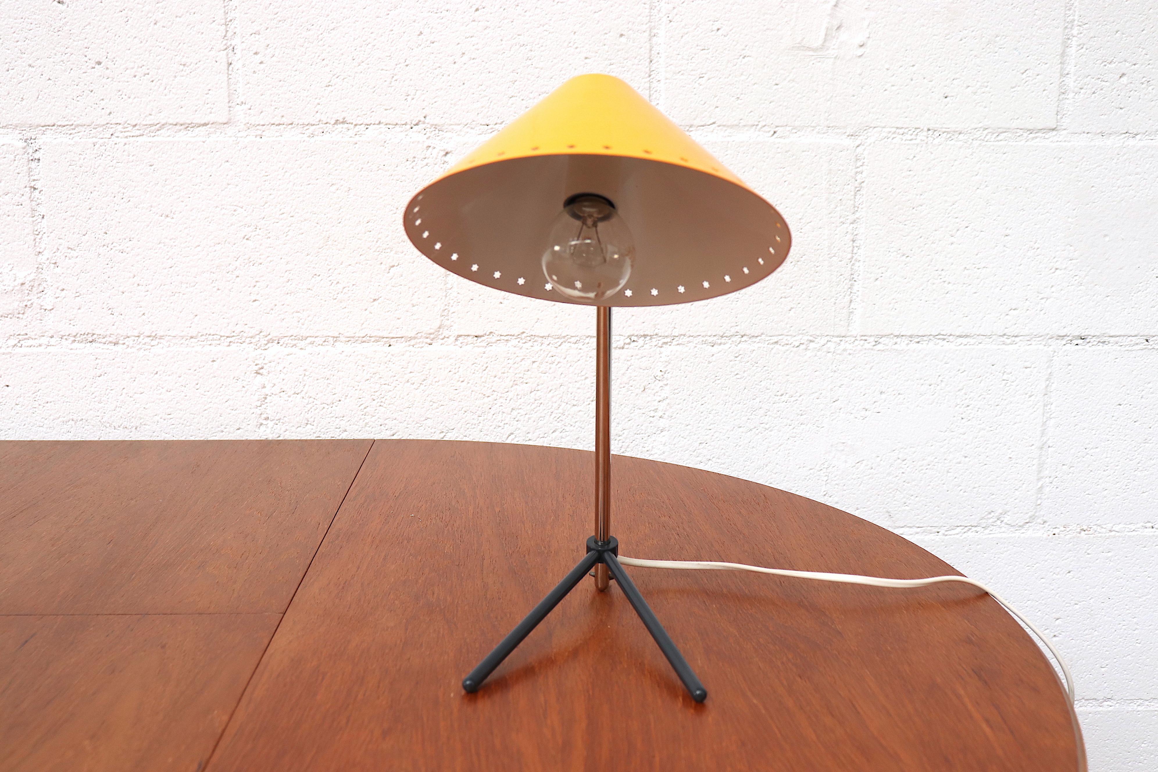 Hala Zeist yellow enameled metal table or wall lamp with Pinocchio shade. Versatile small lamps that function as both table lamp and wall lamp. Great as bedside lamps. New old stock. Also available with red shade, listed separately (LU922418352322).