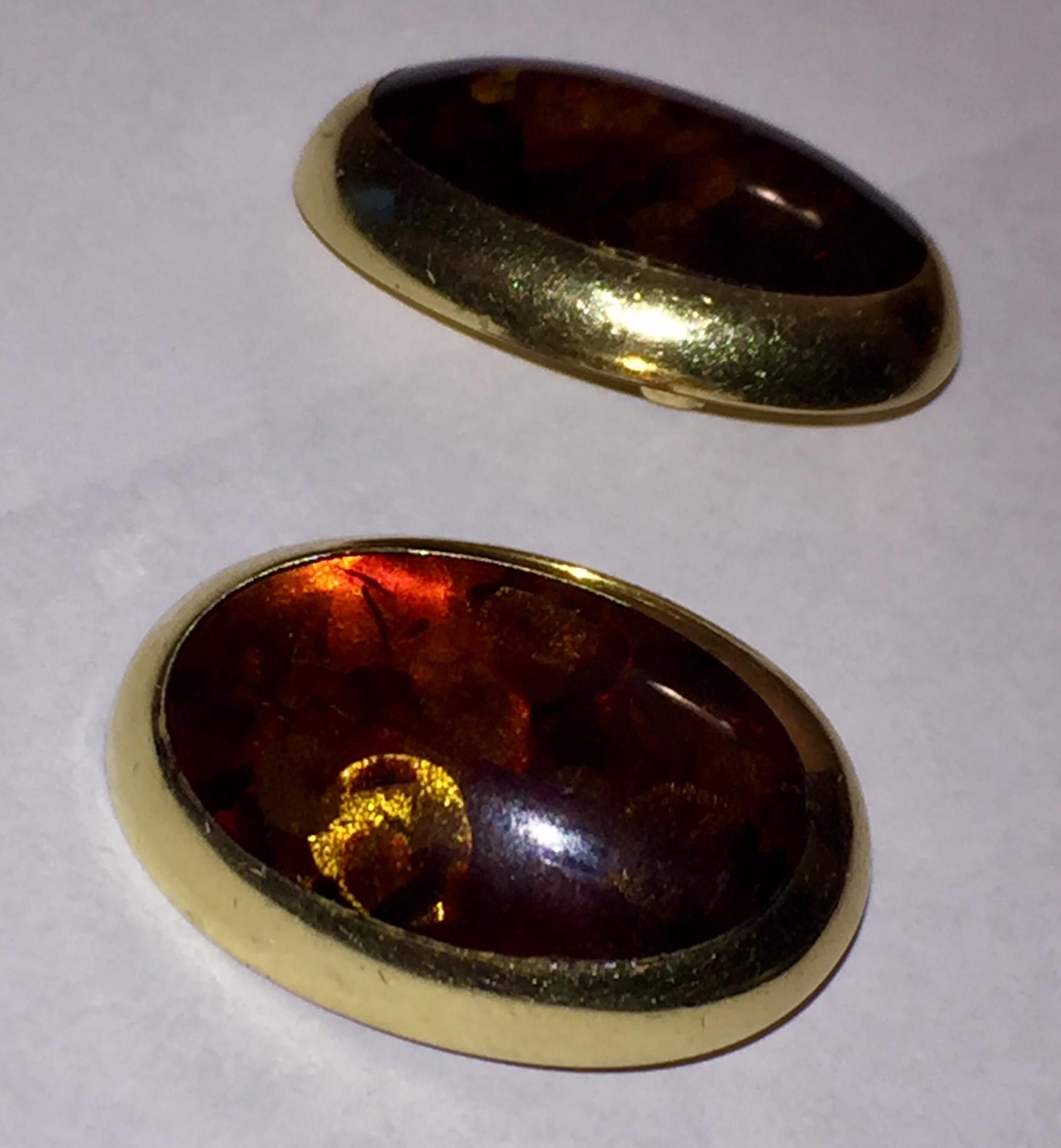 14 karat yellow gold Willy Fagert clip on earrings with orange Baltic amber. Measures 1.5” long by 1” wide. Marked, Halbertstadt, 585, Willy Fagert, Handmade Denmark. Weighs, 27.7 grams