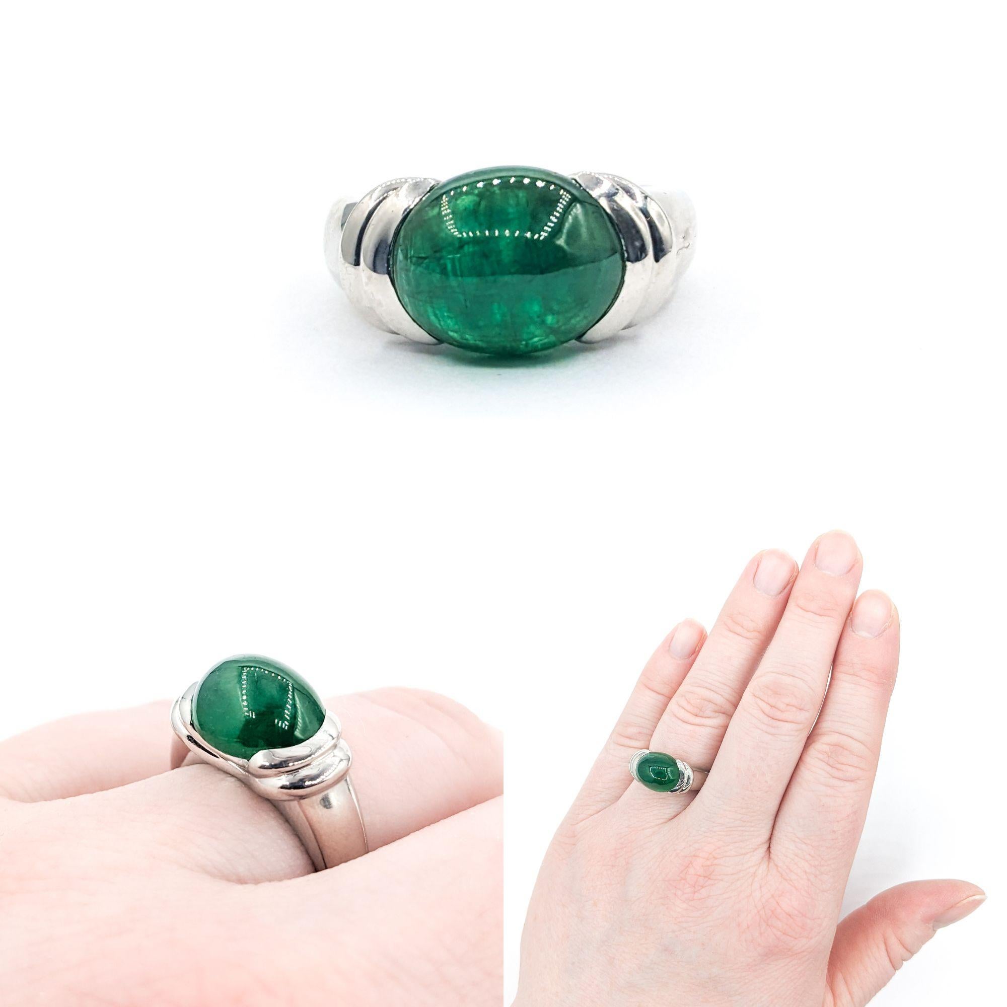 Half Bezel 5.27ct Cabochon Emerald Ring In Platinum

This beautifully crafted Ring in 900 Platinum features a magnificent 5.27ct Cabochon Natural Emerald centerpiece, elegantly set in a sleek Half Bezel setting. The ring's design highlights the