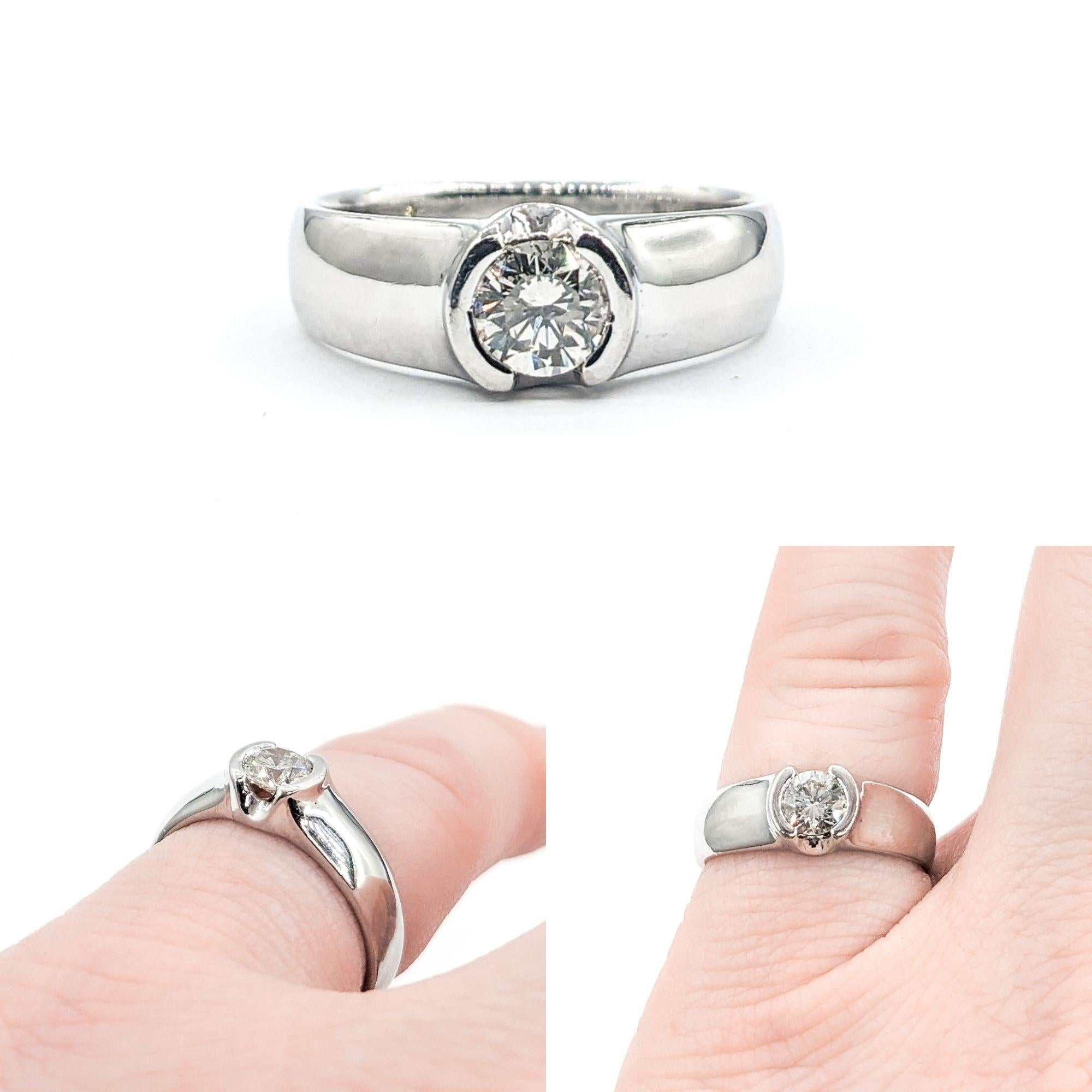 Half Bezel Diamond Engagement Ring In Platinum


This exquisite Diamond Engagement Ring, crafted in premium 900pt Platinum, showcases a stunning .40ct diamond in a Half Bezel Set complemented by a sleek 5mm band. The diamond, boasting I clarity and