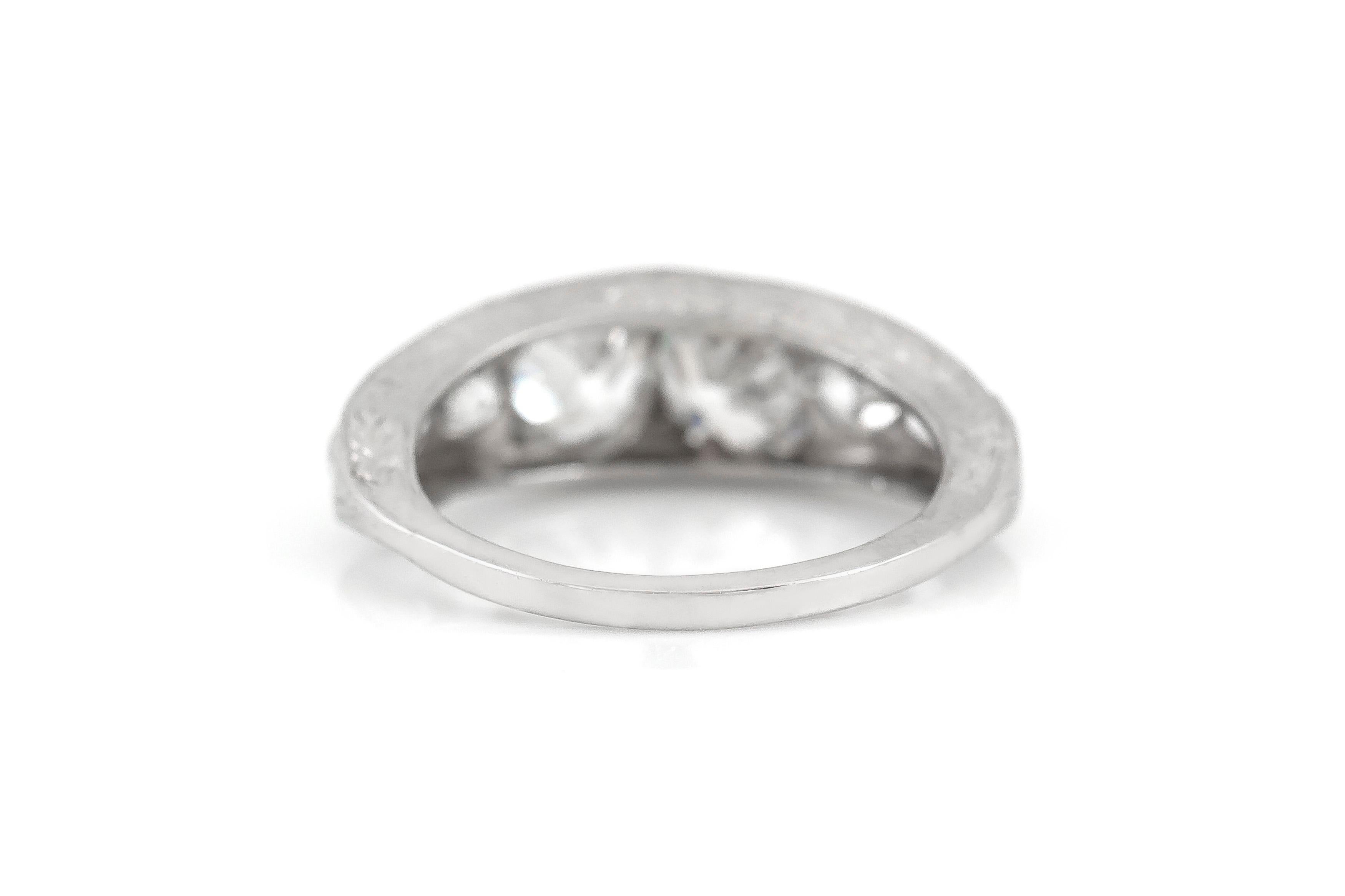 The ring is finely crafted in platinum with diamonds weighing approximately total of 1.90 carat.