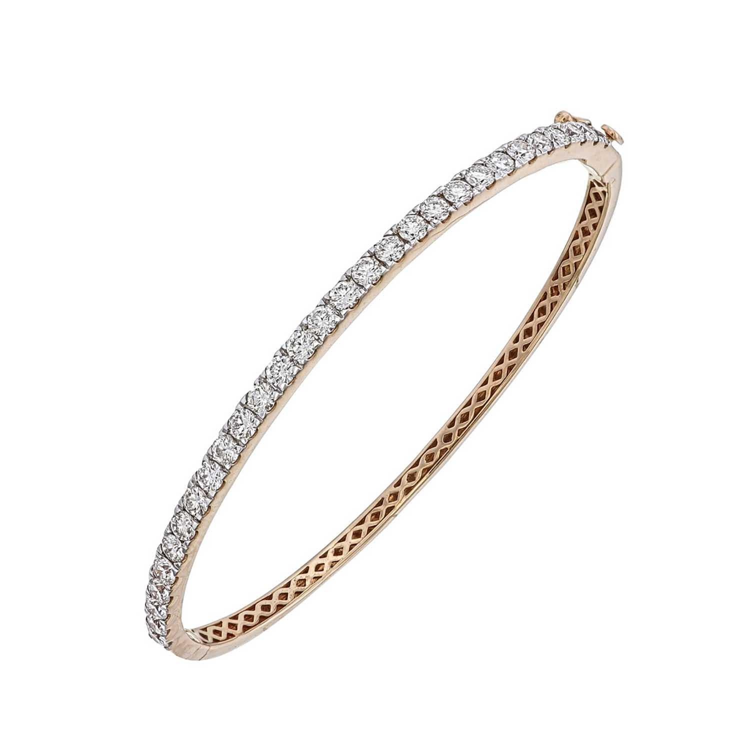 Diamond studded bangle with 29 pieces of 6 pointer each diamonds forming a total of 1.85 ct in total.
It is handmade using natural, untreated diamonds set in 18-karat gold.  the 

Its made in 18kt Rose gold with a safety lock making it very safe for