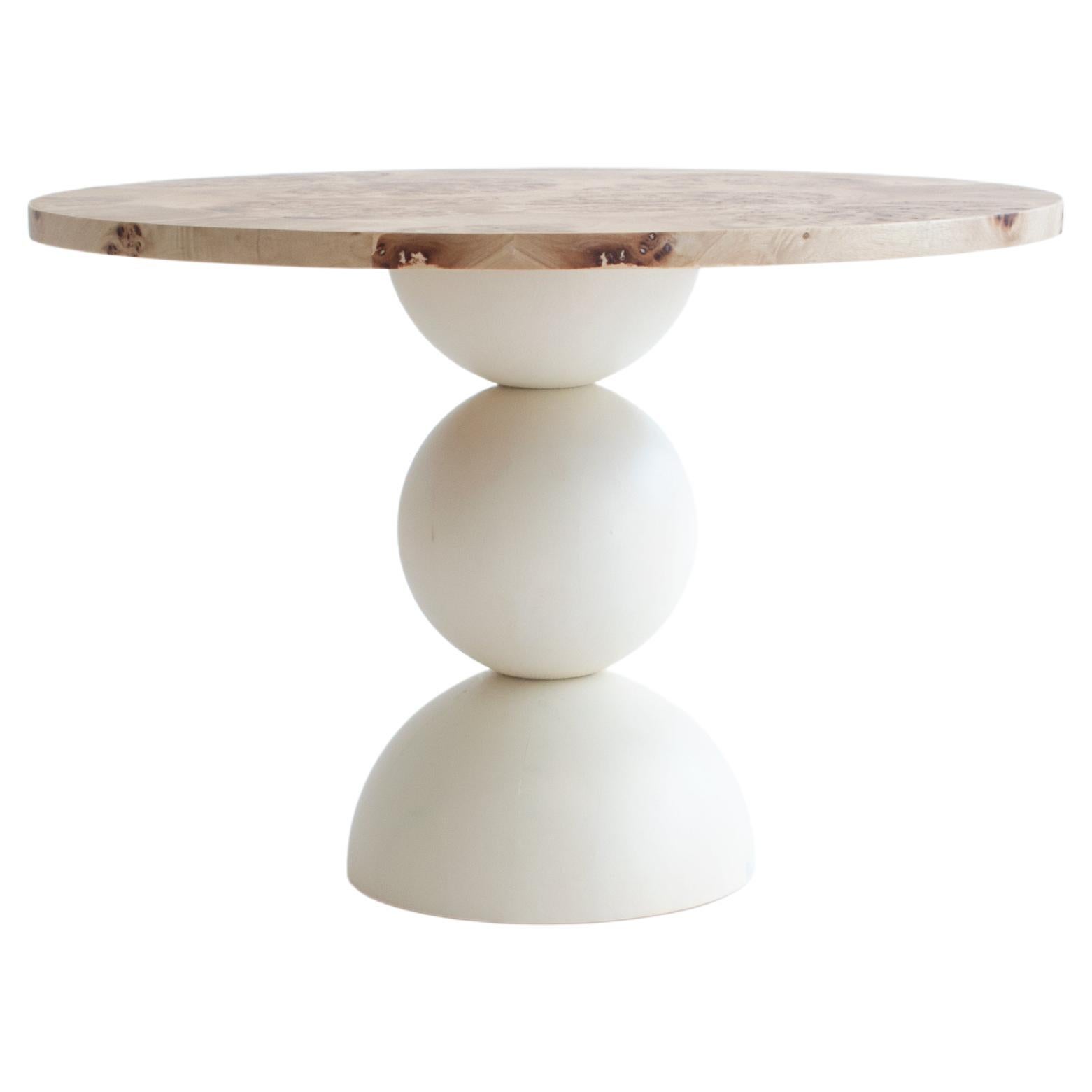 Mapa burl top surface and Swedish pine solid wood half and full spheres transparently matt lacquered. (Available in more colors and veneer types)

The concept for this piece is based on the idea of the circle being perceived from two angles. This