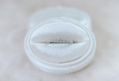 Half-eternity bezel diamond band
