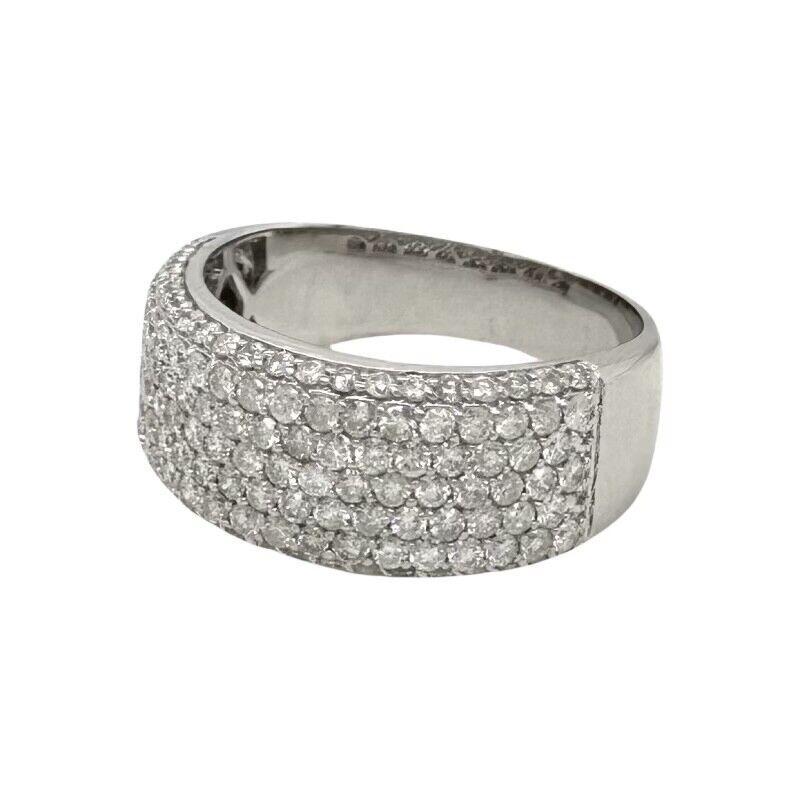 The half eternity diamond ring in 14k white gold exudes elegance and sophistication with its timeless design. Crafted to perfection, it features 100 dazzling round-cut diamonds, each weighing 0.02 carats. These diamonds are meticulously set along