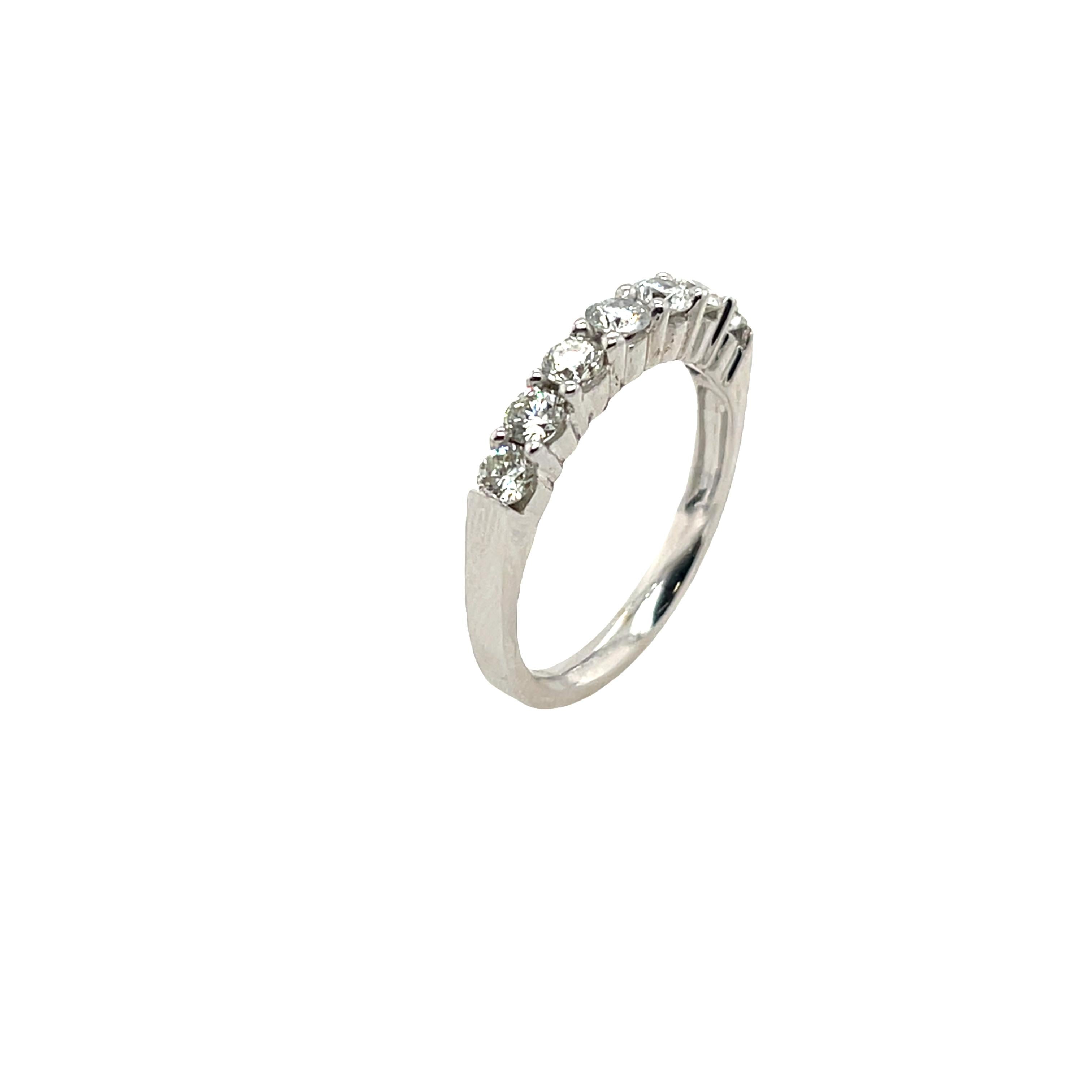 This diamond half eternity band is set with 0.75ct round brilliant cut diamonds. This ring is elegant and beautiful for wedding ring, set in 18ct white gold.

Total Diamond Weight: 0.75ct 
Diamond Colour: G/H
Diamond Clarity: SI1
Width of Band: