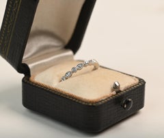 Half Eternity Platinum Band. 0.10TCW Round and Pear Shape Diamond Wedding Ring