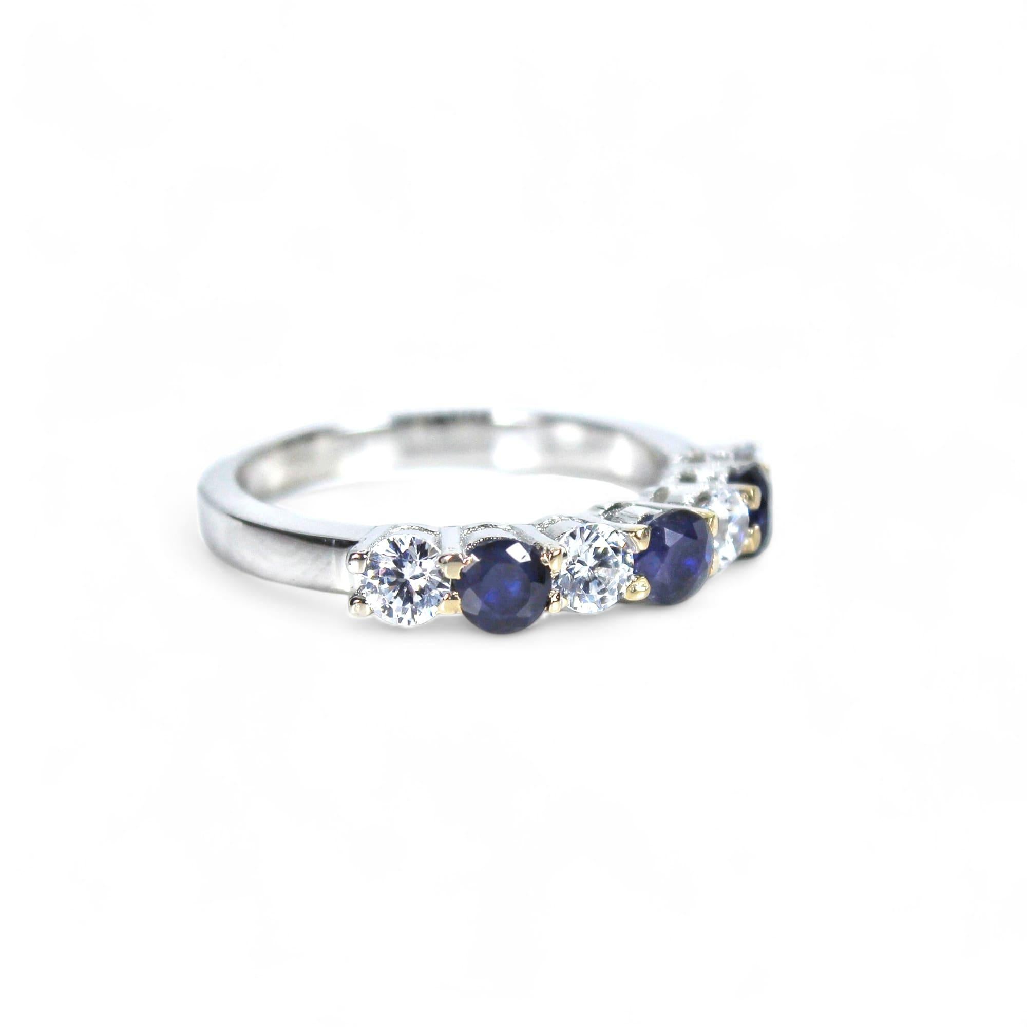 Metal - Silver
Indian ring size - 10
Product gross Weight - 2.540 Grams
Gemstone - Natural Blue Sapphires
Total stone weight - 0.65 Cents
Stone shape - Round
Stone size - 3 x 3 mm
Diamonds - Swarovski

This half eternity ring in silver is