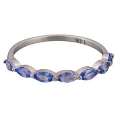 Half eternity tanzanite ring in 14k gold. 