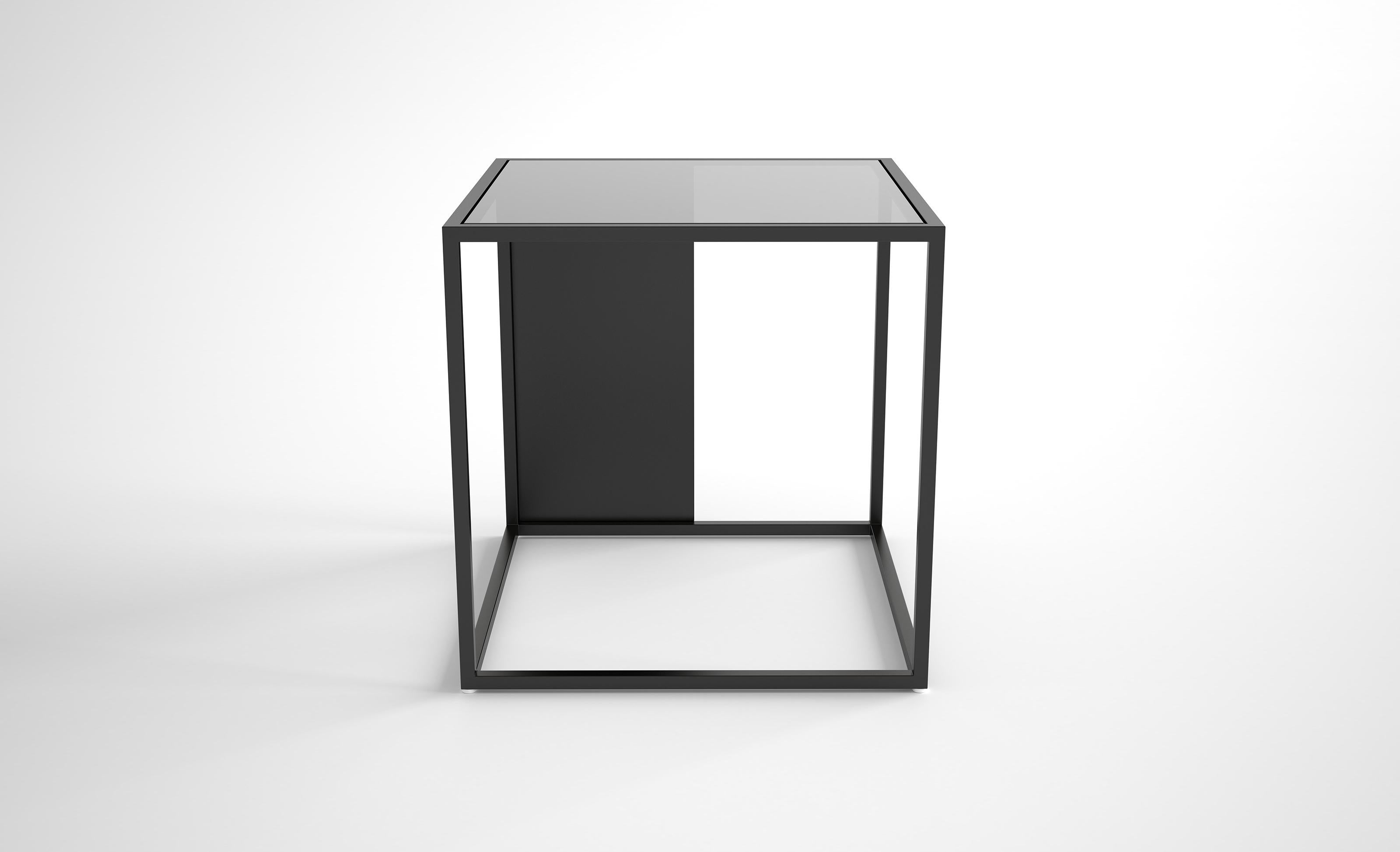 Half & Half Side Table by Phase Design
Dimensions: D 40.6 x W 40.6  x H 40.6 cm. 
Materials: Powder-coated metal and glass. 

Powder-coated square steel bar available with starphire or grey glass top. Powder coat finishes are available in flat black