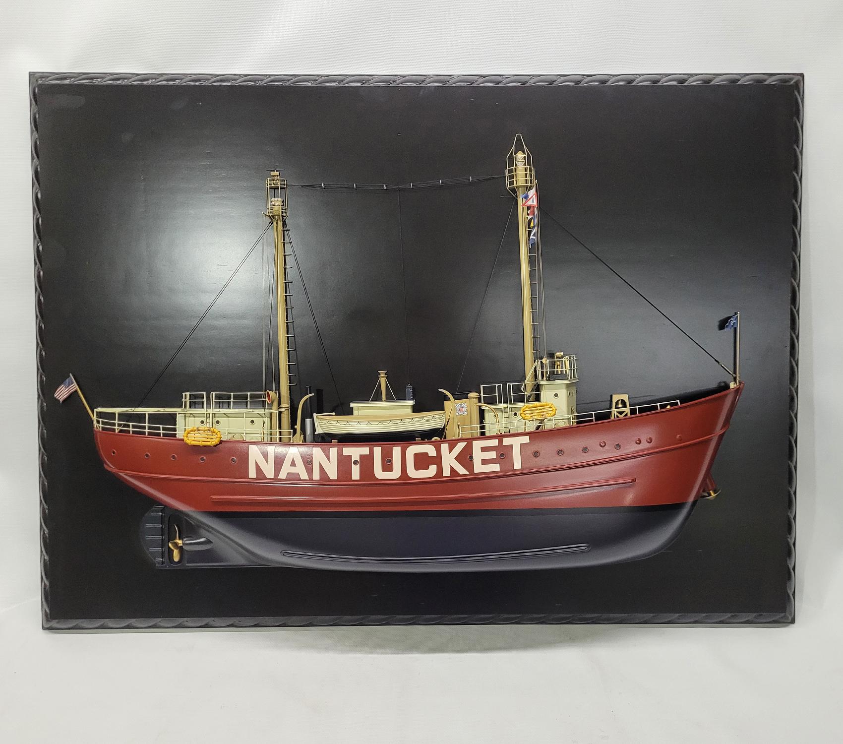 Museum quality half model of the Lightship Nantucket. This fine model has a carved hull, countless milled brass fittings, built up cabins, etc. Details include masts with signal flags, railings, lifeboat, stove pipe, bell, winch, funnel, etc.