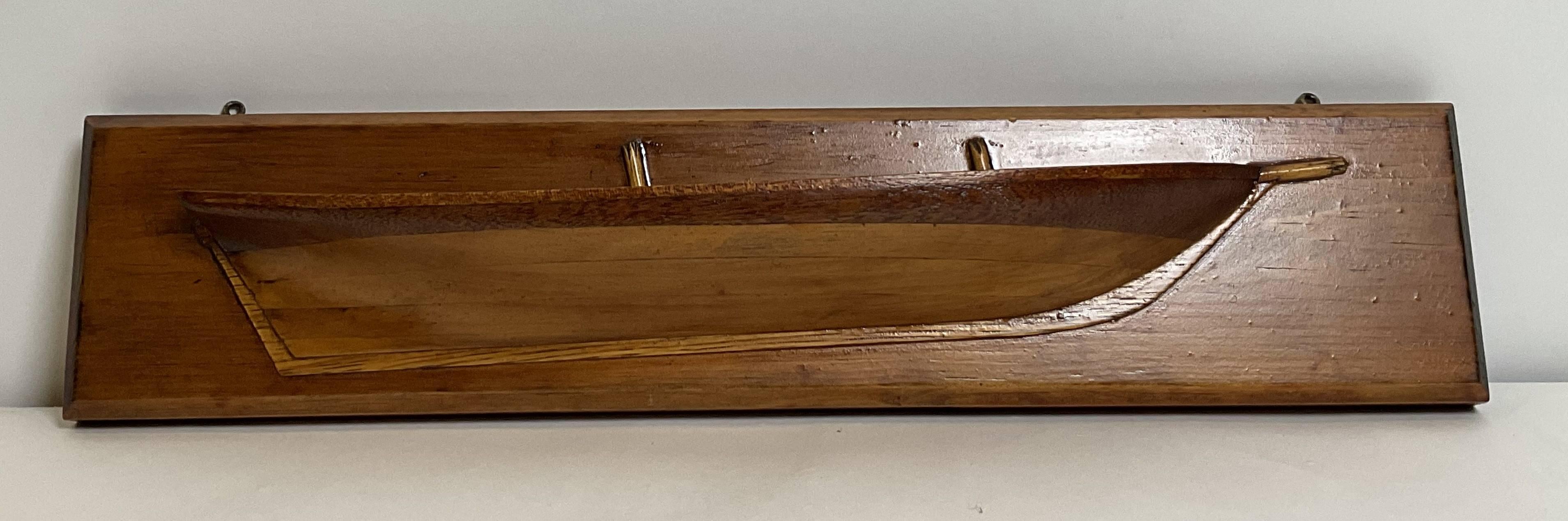 Antique ships half model of the two masted Schooner Swift. The Swift was built in 1778 during the American Revolution. Captured by the British Royal Navy in 1779 and used until 1783. This model has a laminated wood hull built of six lifts. Warm