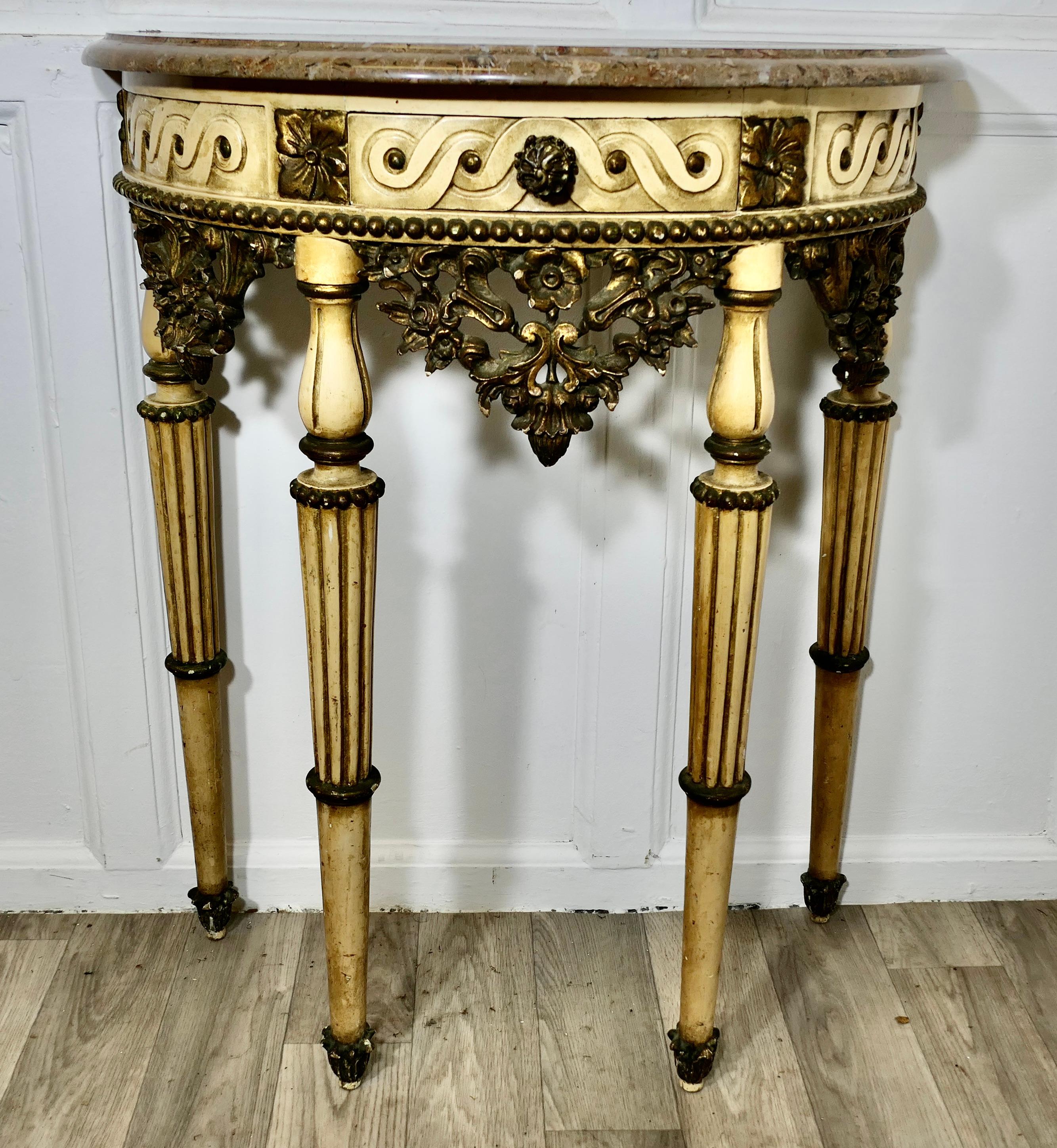Half Moon Carved and Painted Console or Hall Table  

This is a very attractive piece it is carved in the French Provincial Louis Philippe style, the paint is original and has a cream background with tones of Smoky Grey Green and touches if gilt