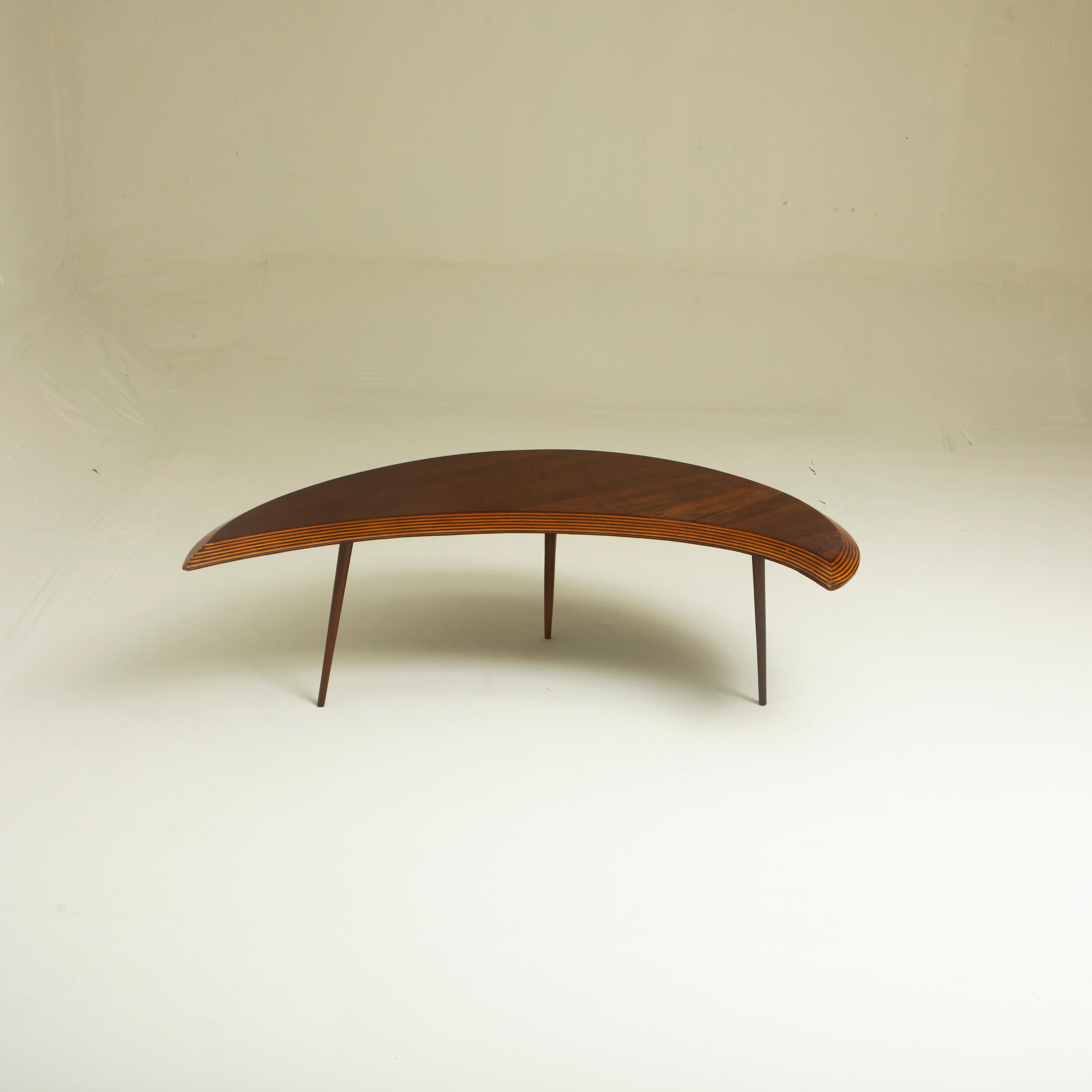 'Half Moon' Center Table by CIMO Studio, Brazil, 1950s

Center table structured in wood and plywood, with a half-moon design, supported on three solid wood legs, manufactured by CIMO Studio, circa 1950s.