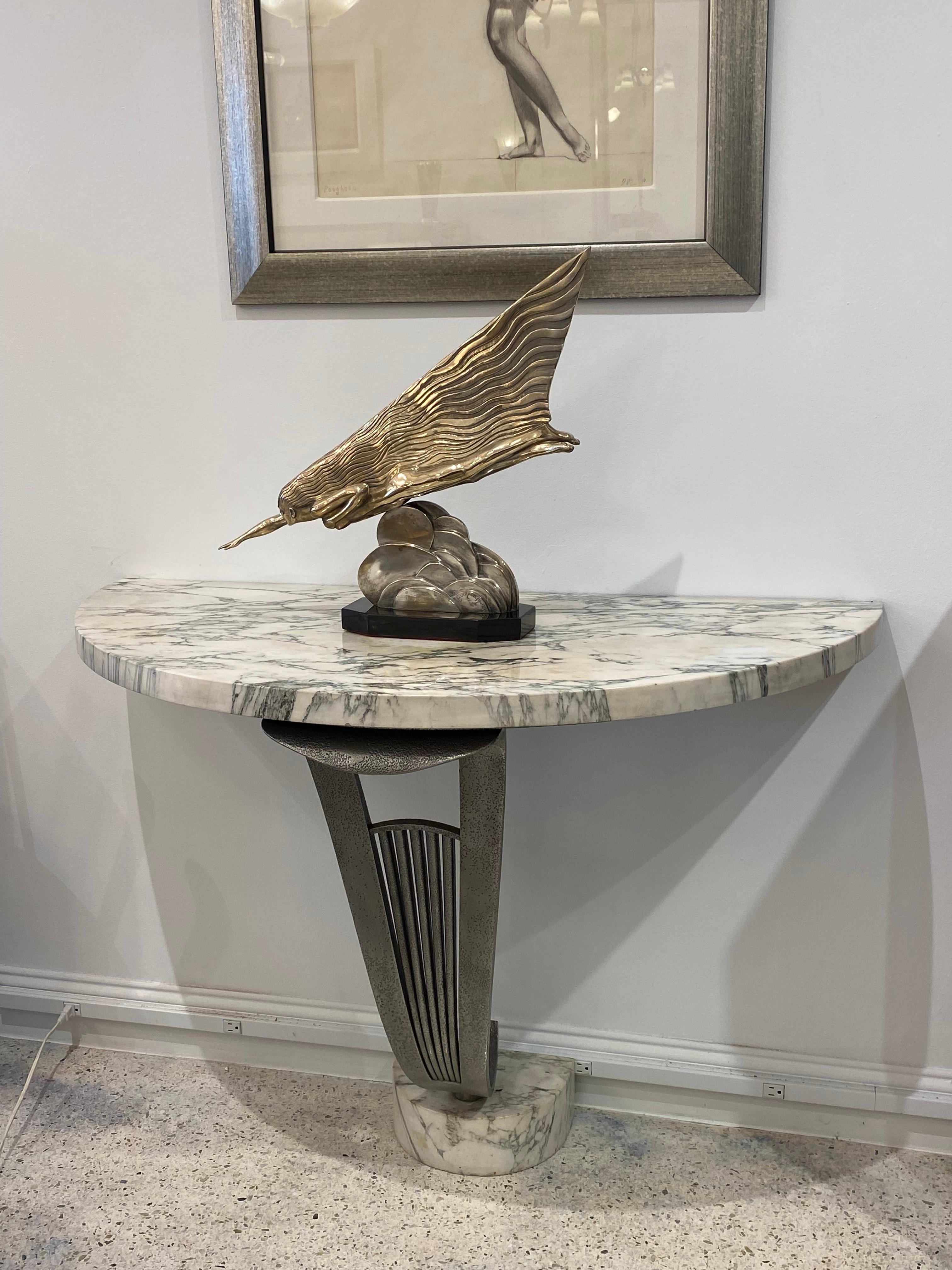 A Gorgeous half moon shaped console in wrought iron and calacatta marble top by Raymond Subes.
Made in France.